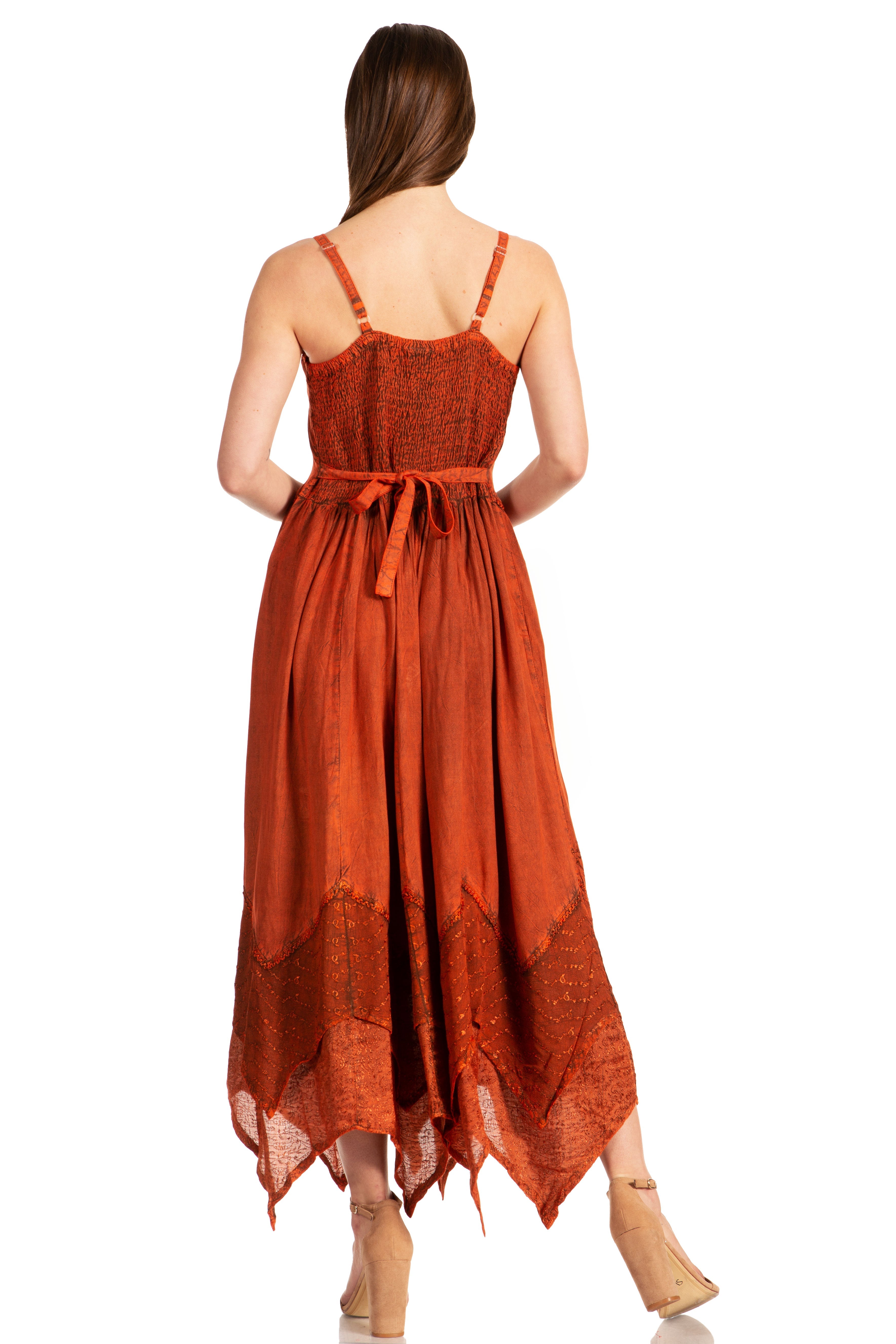 Woman wearing an orange dress with a white background