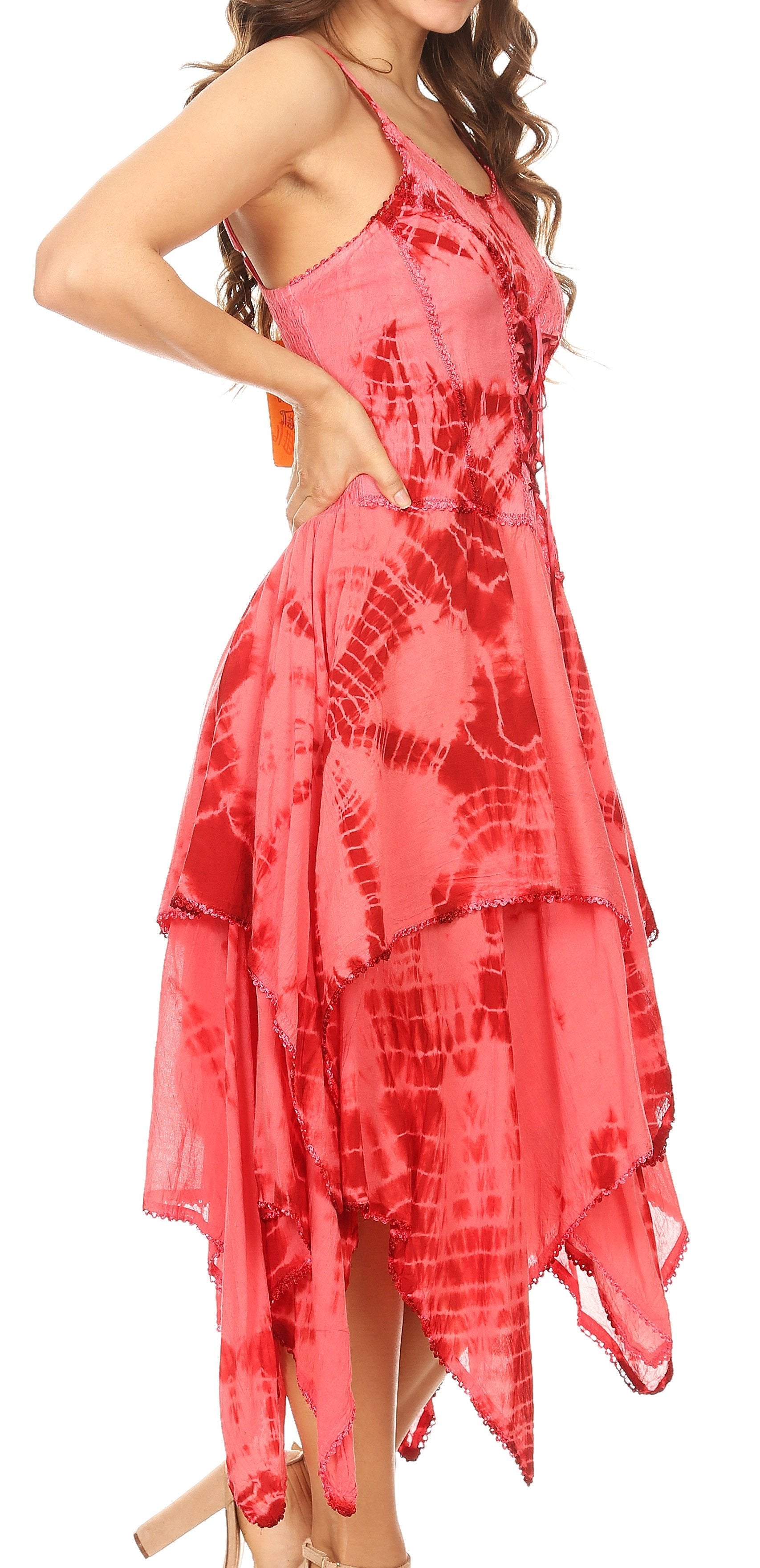 Woman wearing a pink tie-dye dress on a white background