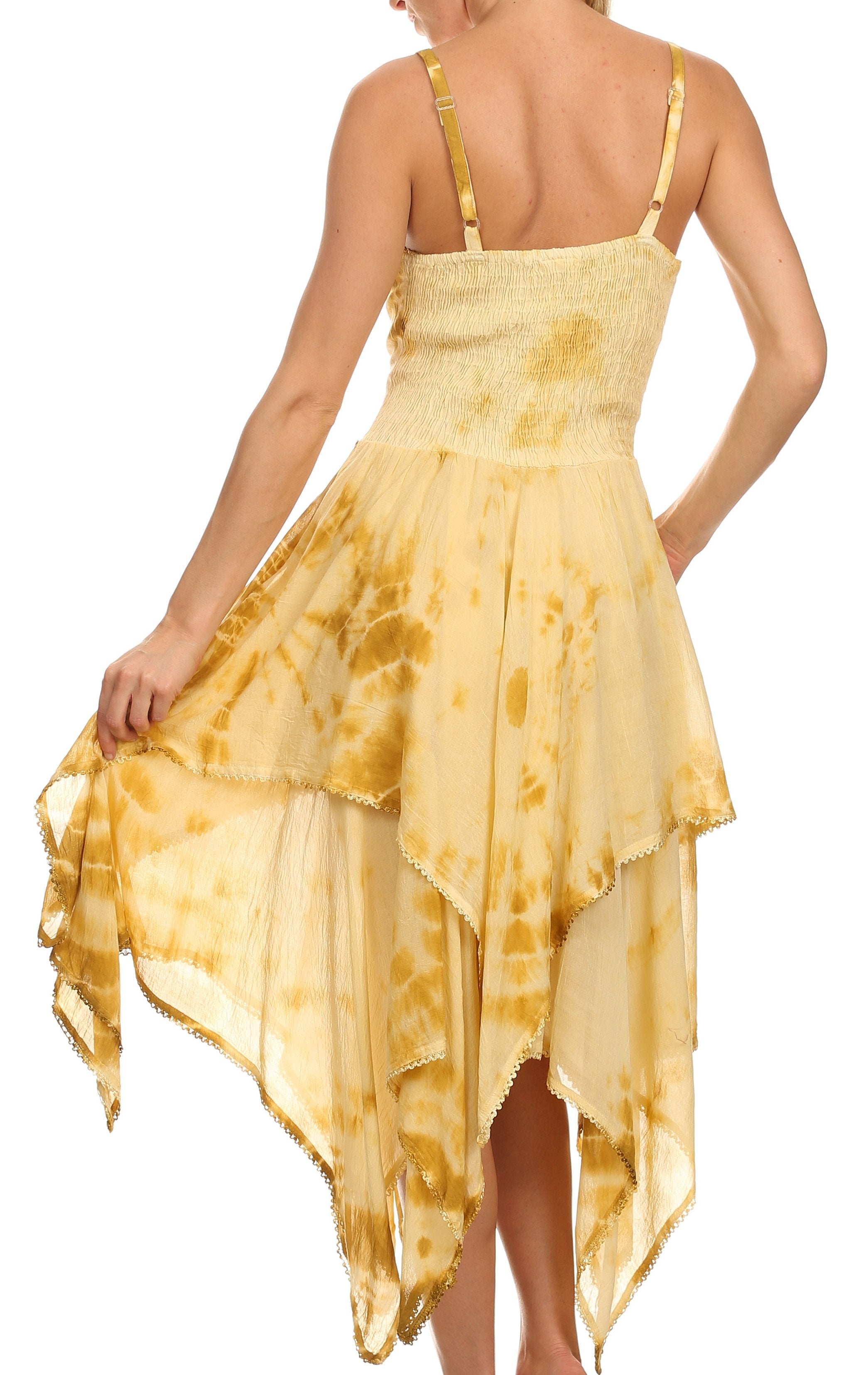Woman wearing a yellow tie-dye dress on a white background