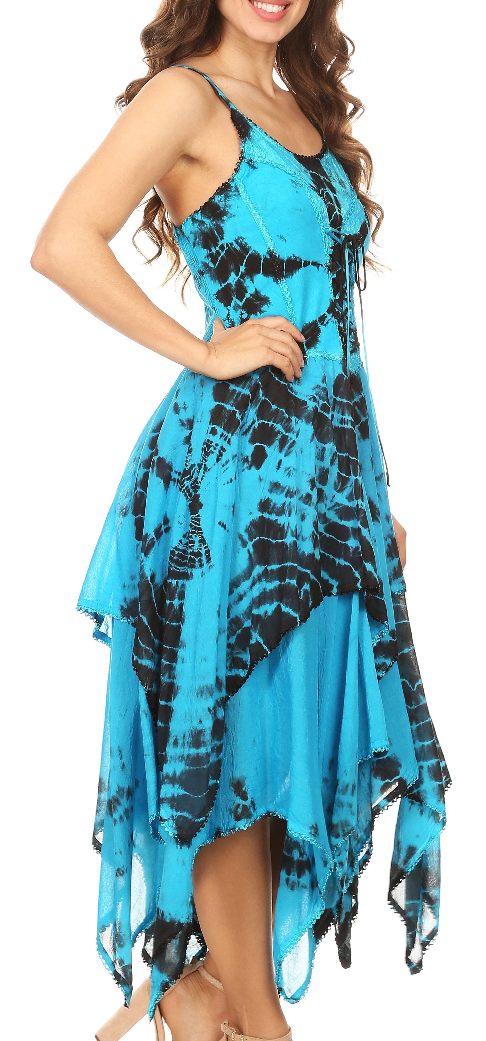 Woman wearing a blue and black tie-dye dress on a white background