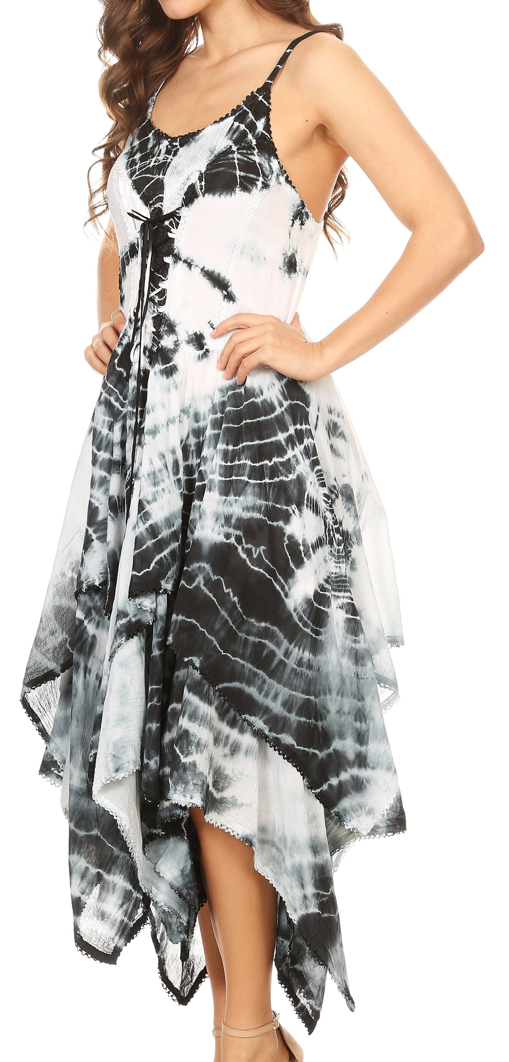 Woman wearing a black and white tie-dye dress on a white background