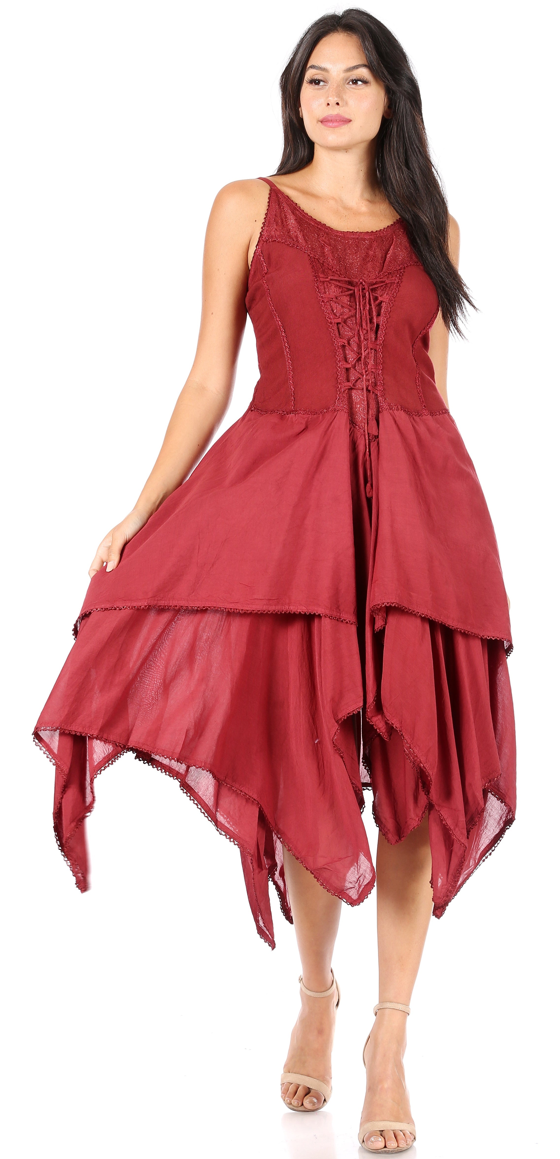 Woman wearing a red dress with a layered skirt on a white background