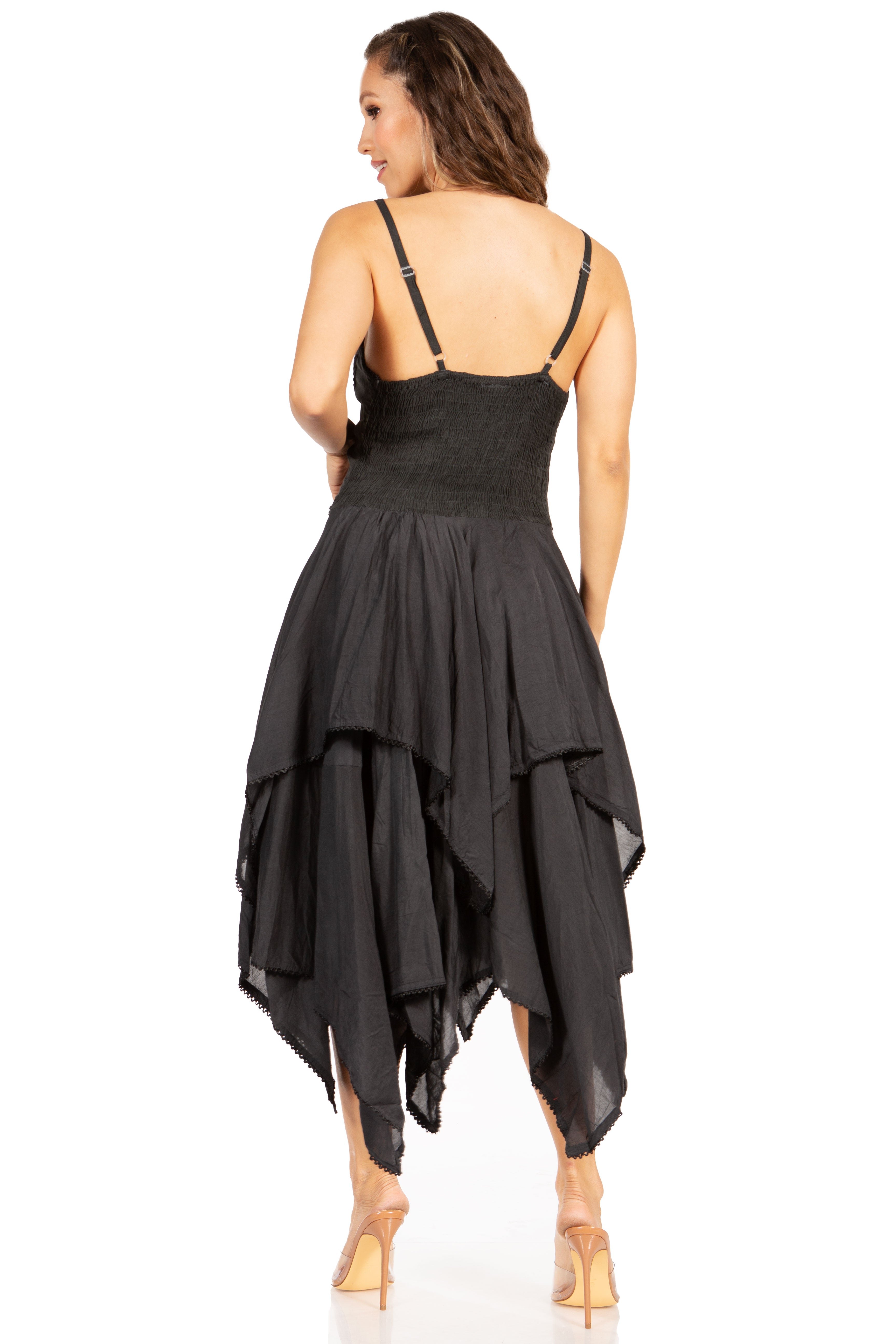 Black dress with a unique layered skirt design on a white background