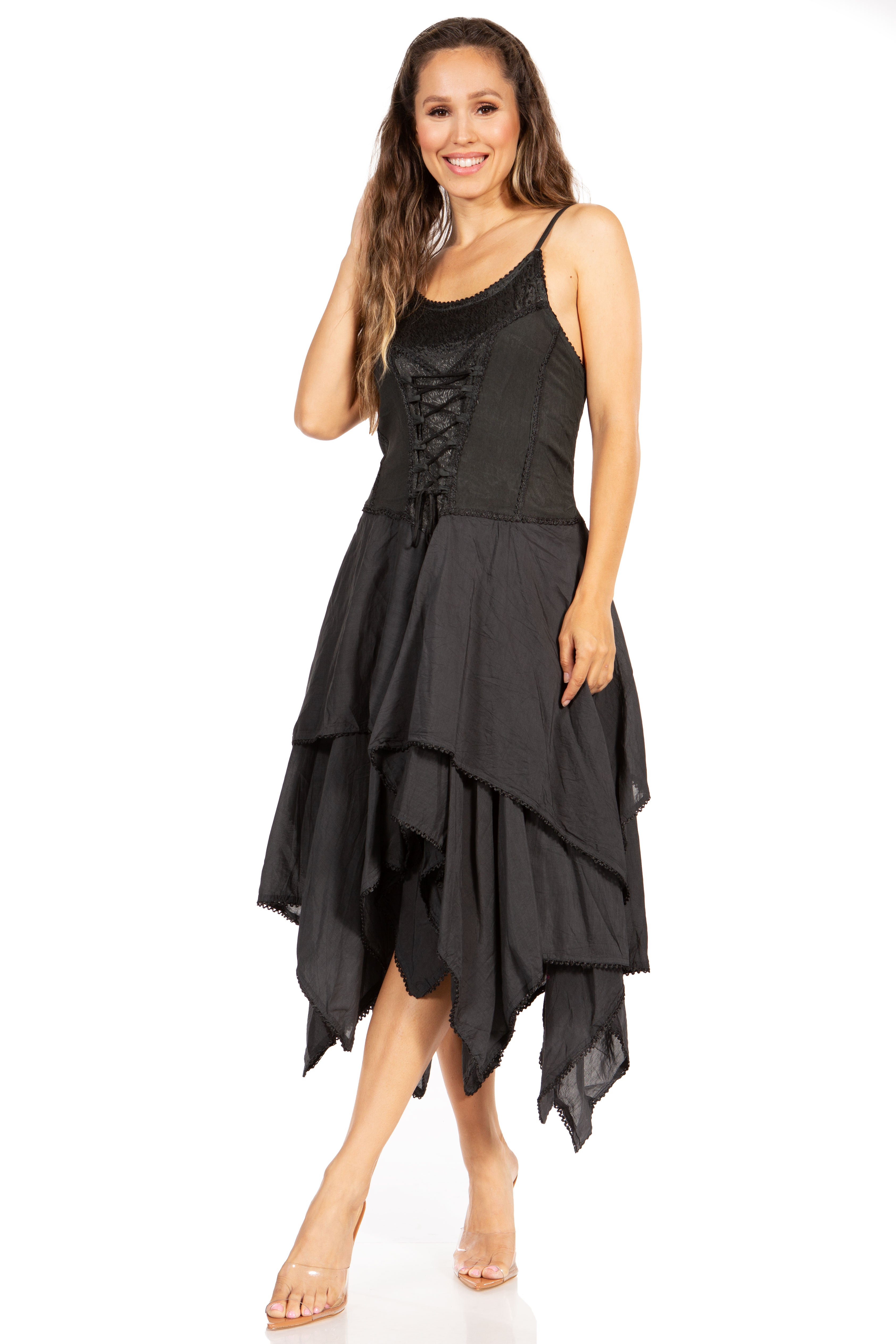 Woman wearing a black sleeveless dress with an asymmetrical hem on a white background
