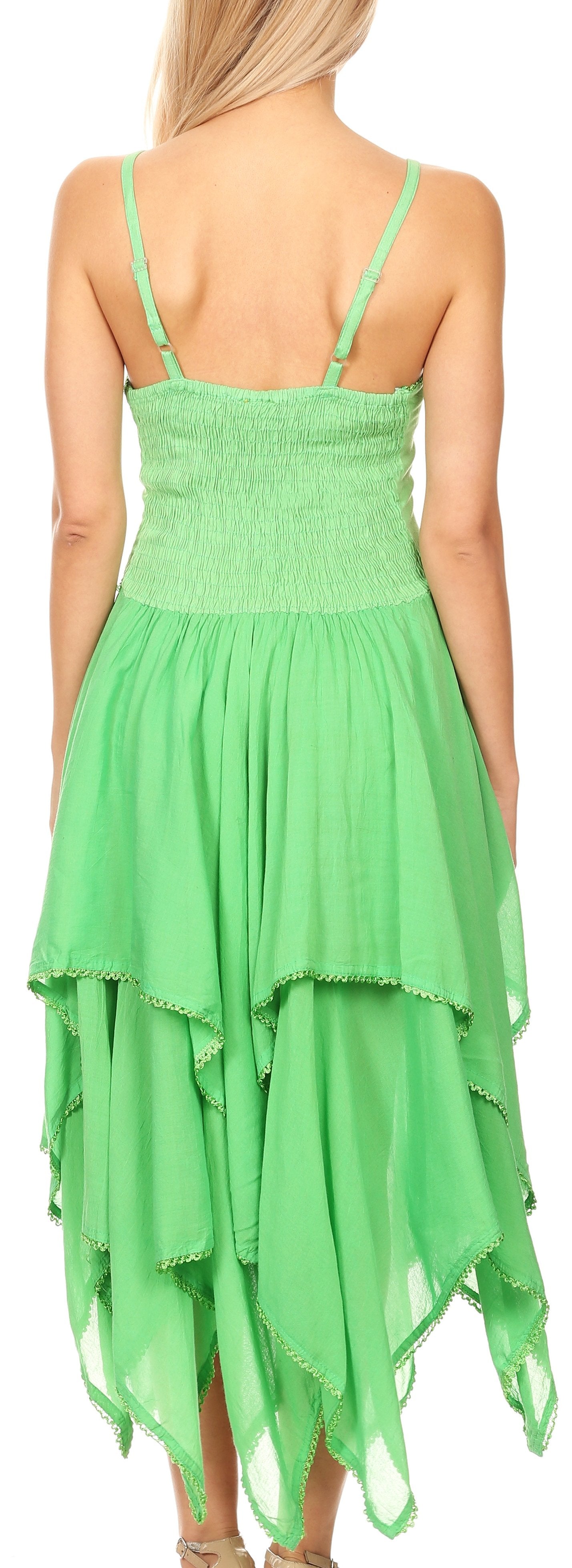 Green dress with thin straps and layered skirt on a model