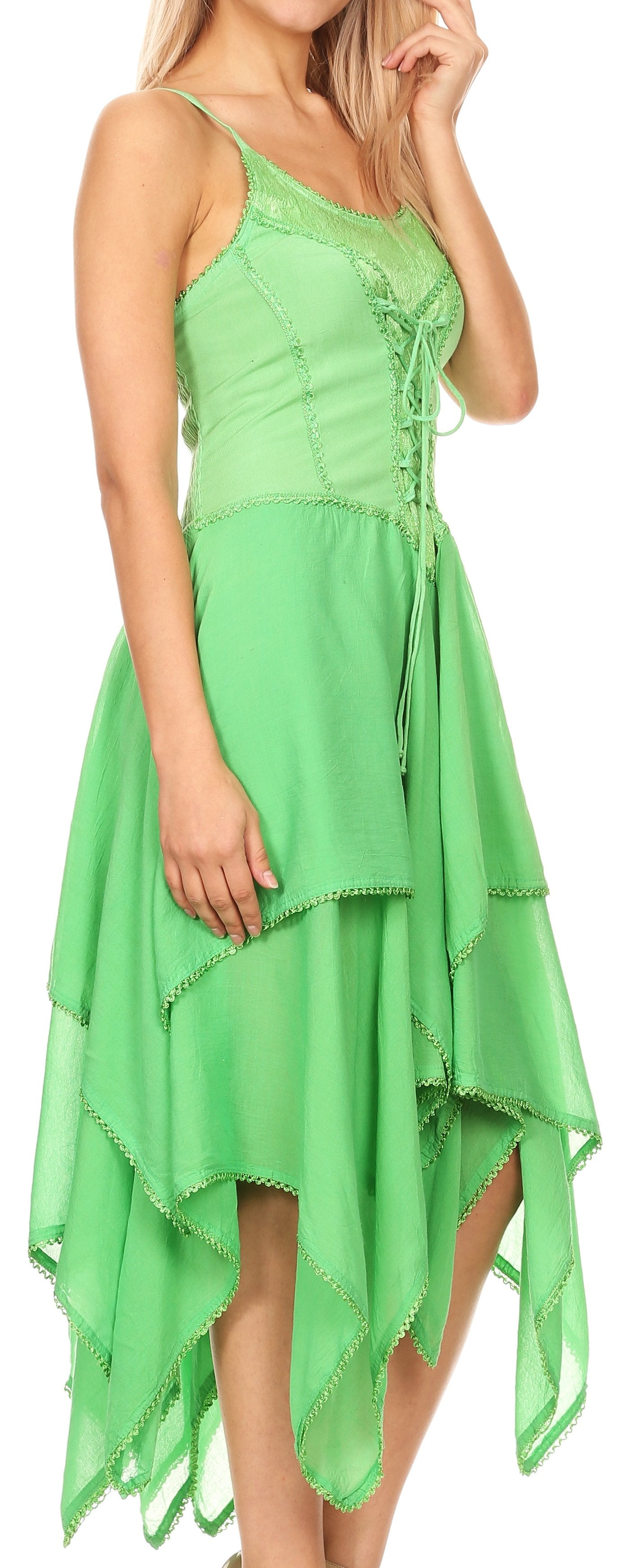 Woman wearing a green dress with a unique cutout design.