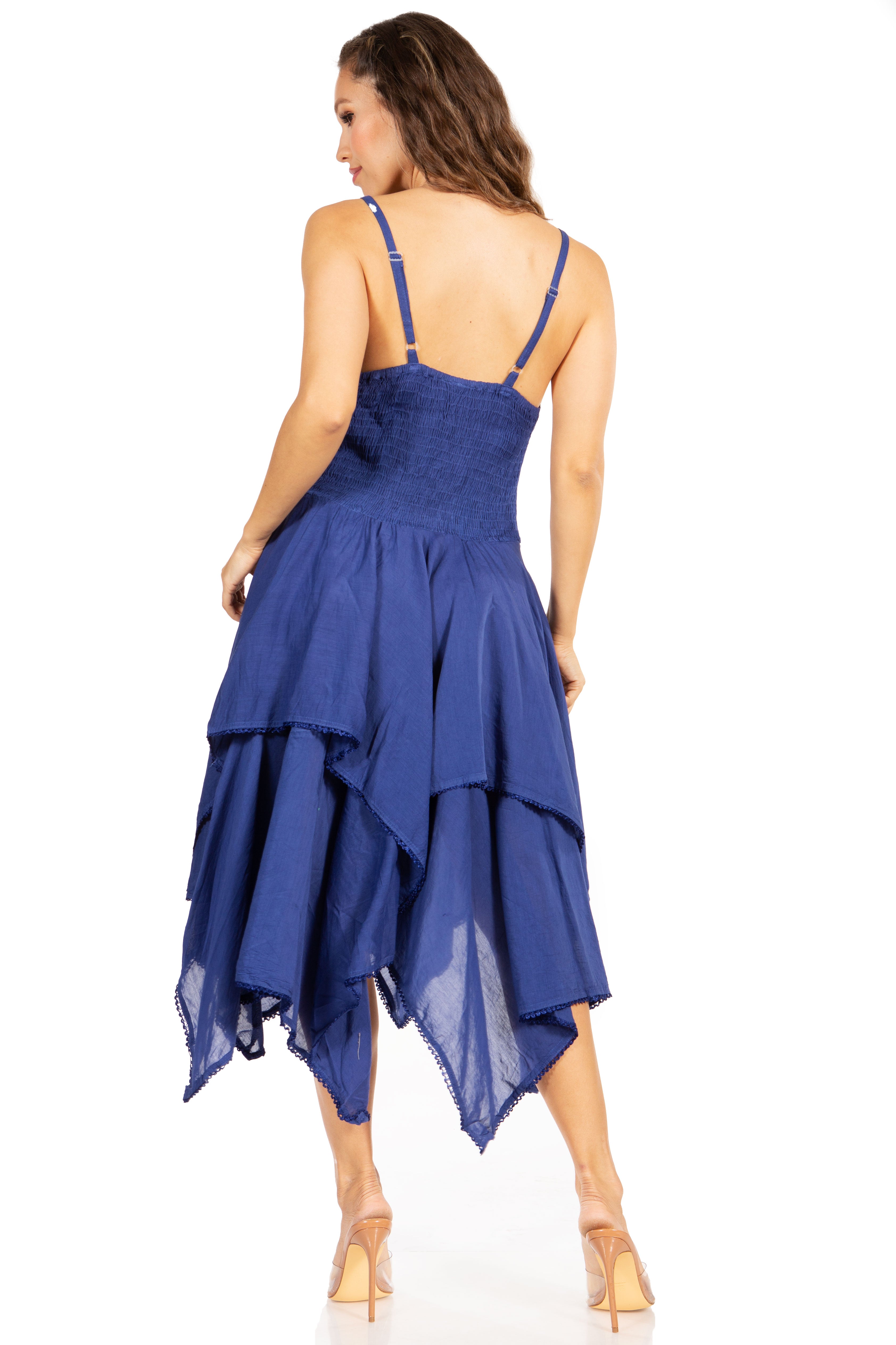 Woman wearing a blue dress with a white background