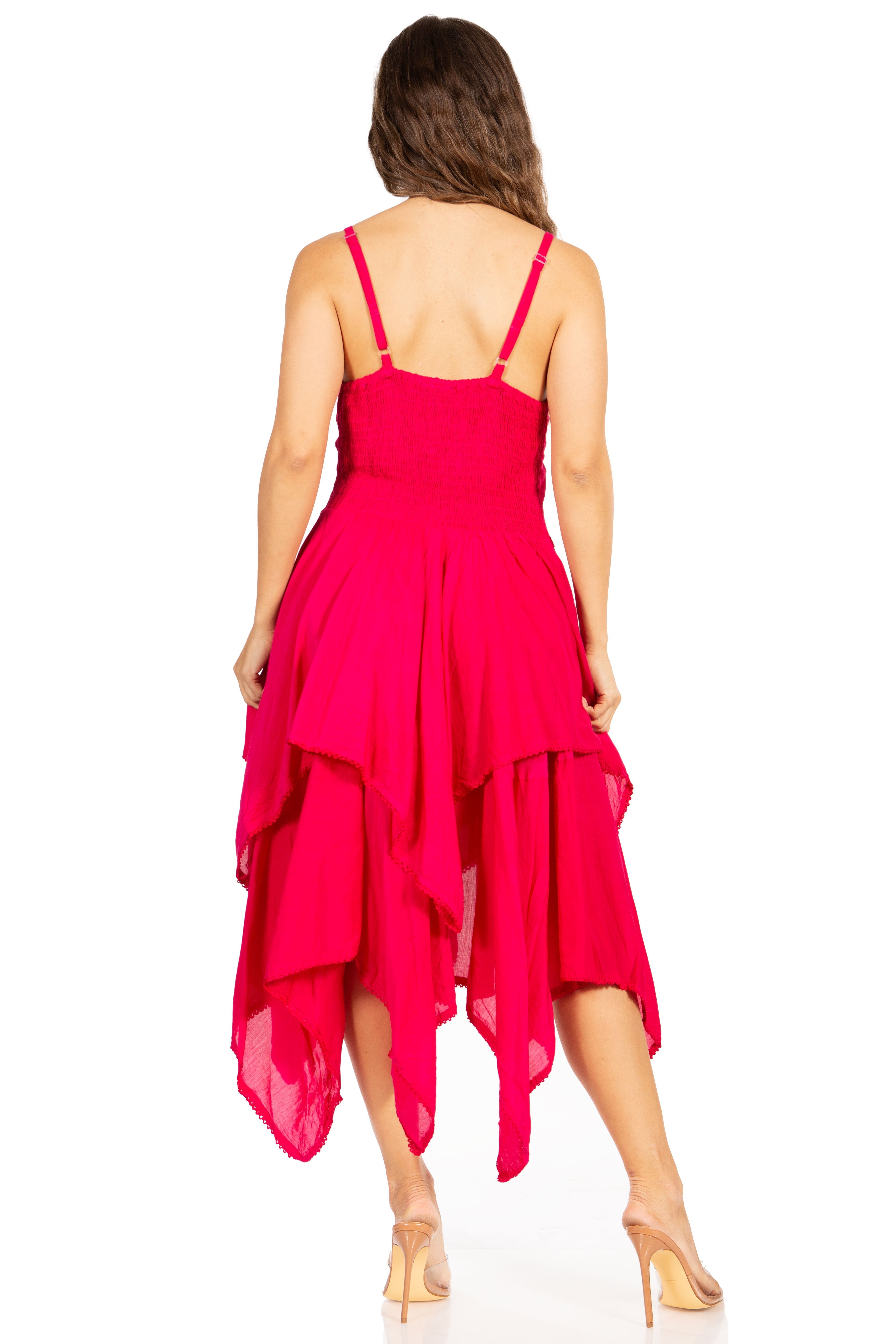Woman wearing a bright pink dress with a white background