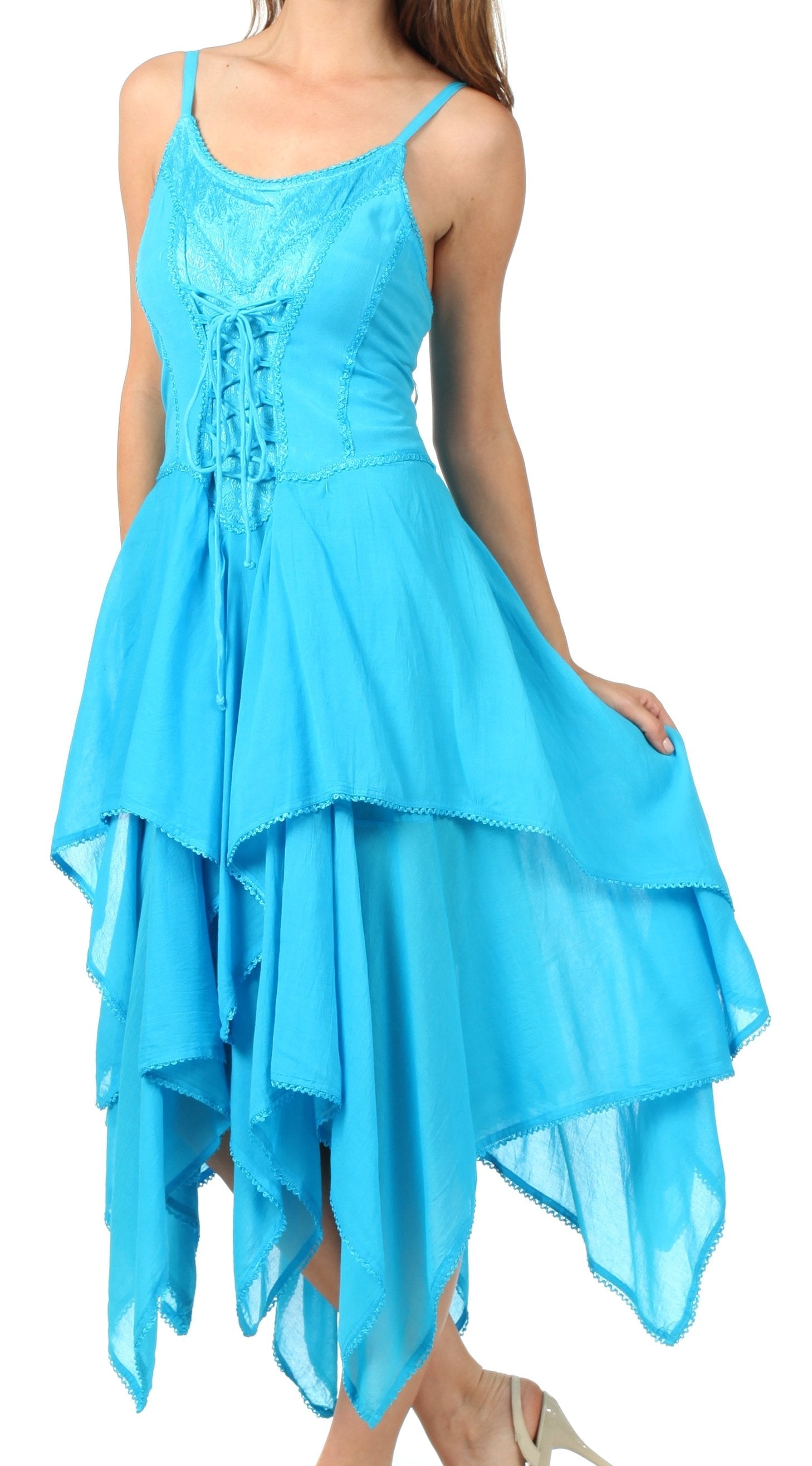 Woman wearing a blue dress with a layered skirt on a white background