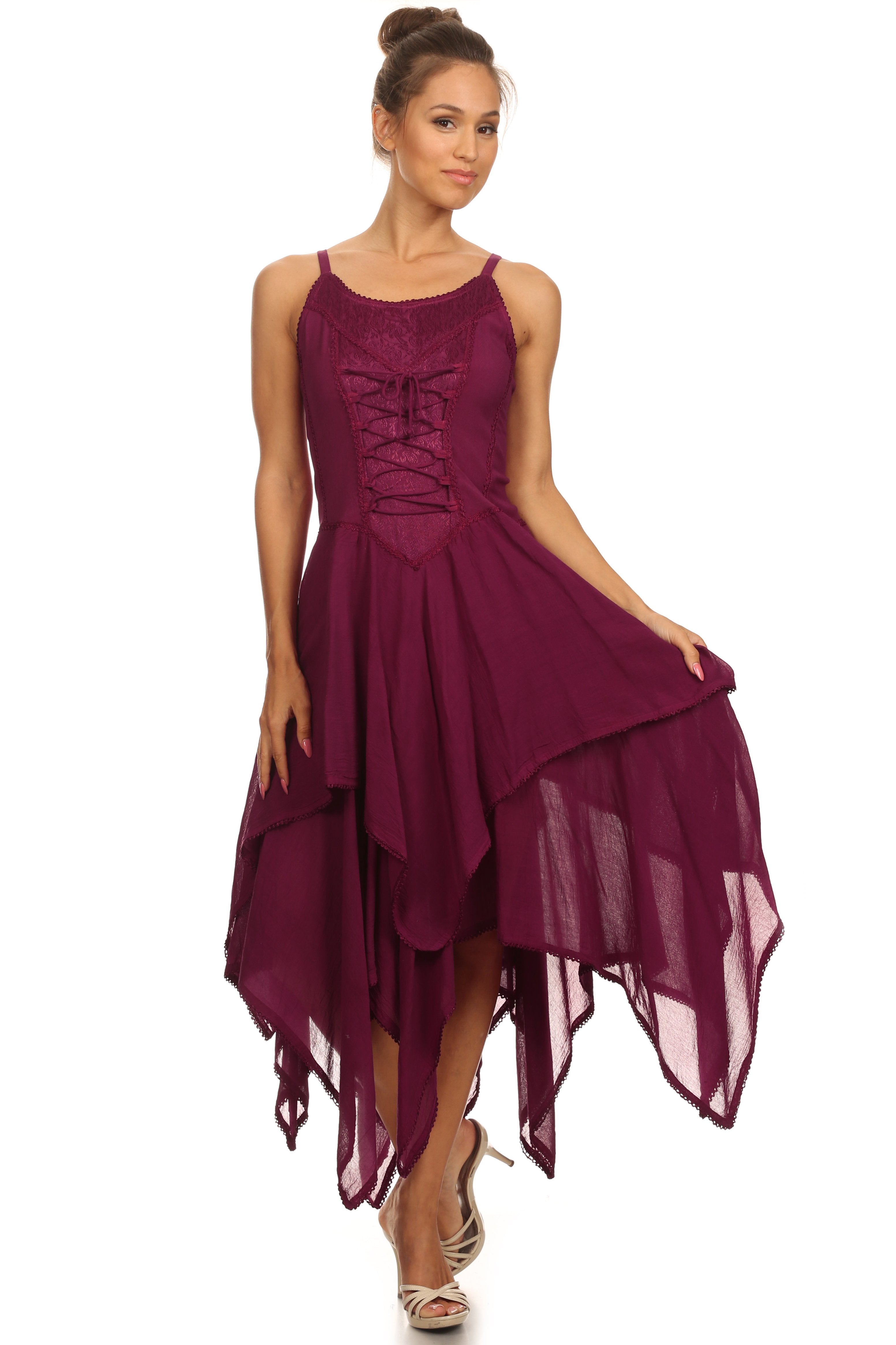 Woman wearing a burgundy dress with a lace-up front on a white background