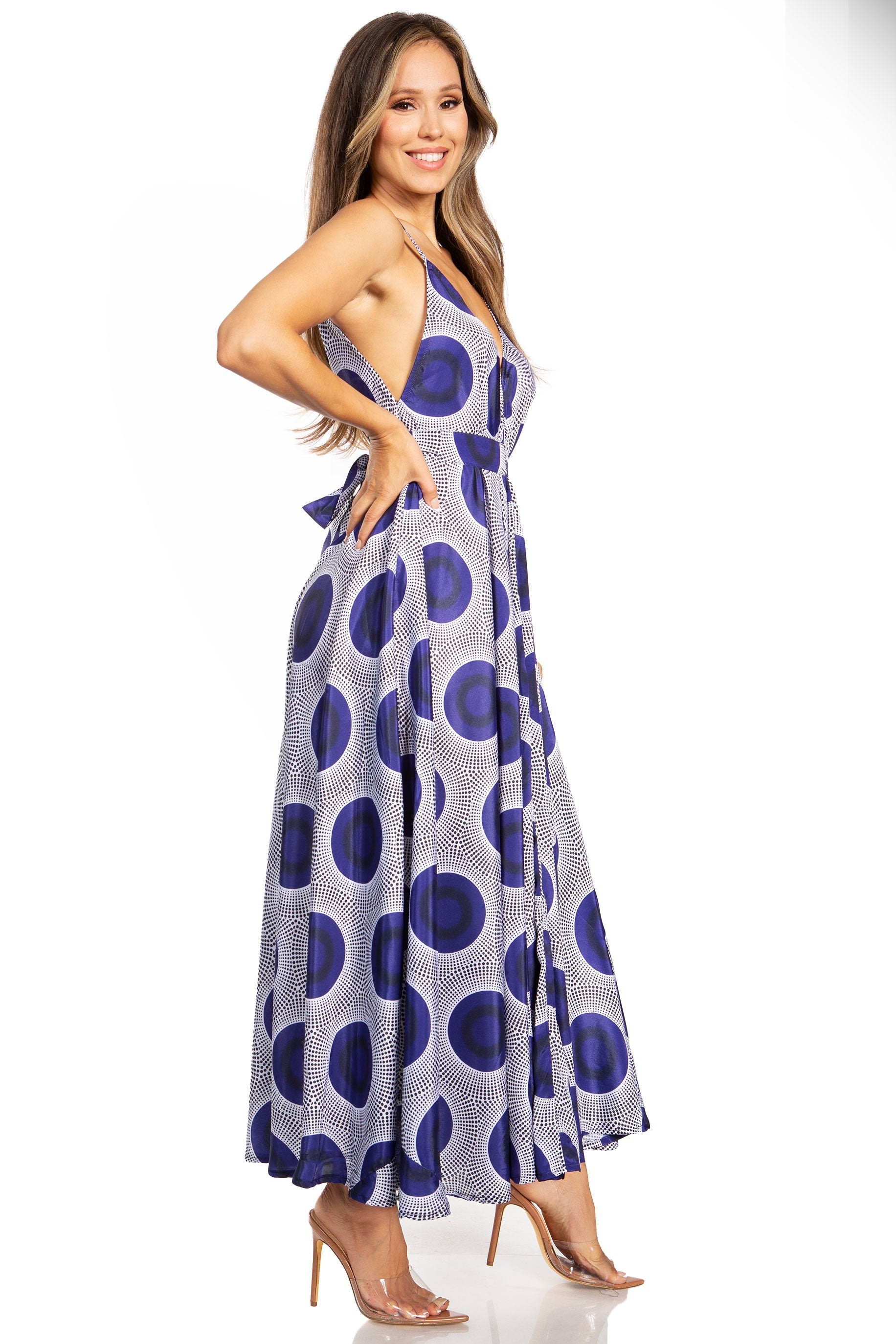 Woman wearing a blue and white patterned dress on a white background