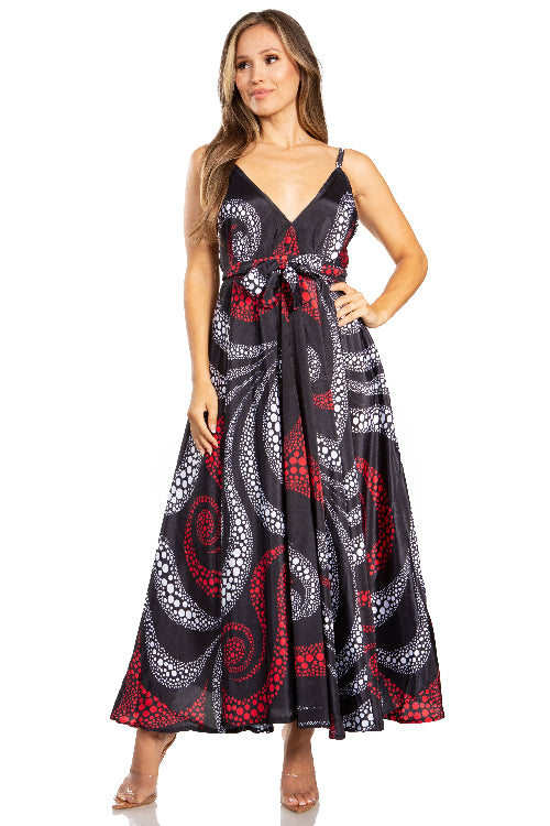 Woman wearing a long, patterned dress on a white background