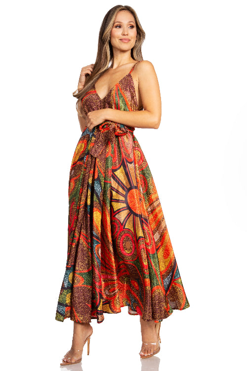 Woman wearing a colorful patterned dress on a white background
