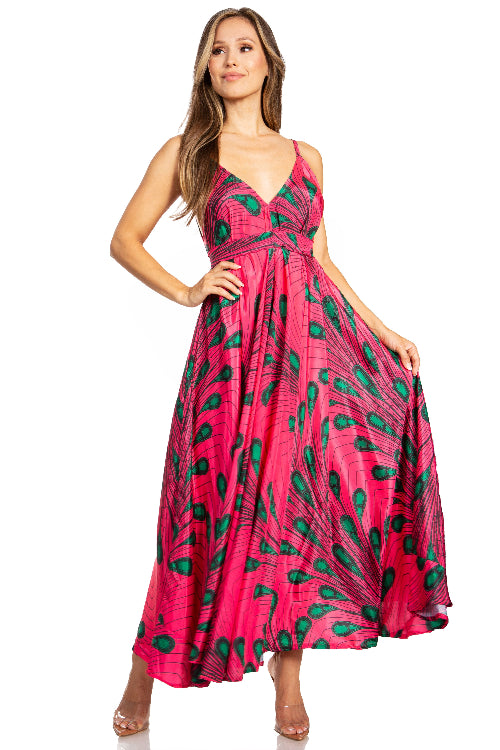 Woman wearing a pink dress with green pattern on a white background