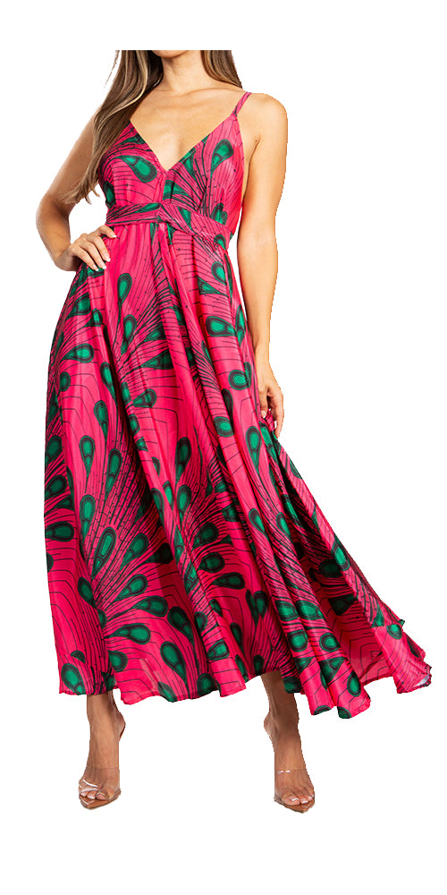 Woman wearing a pink dress with green peacock feather pattern on a white background