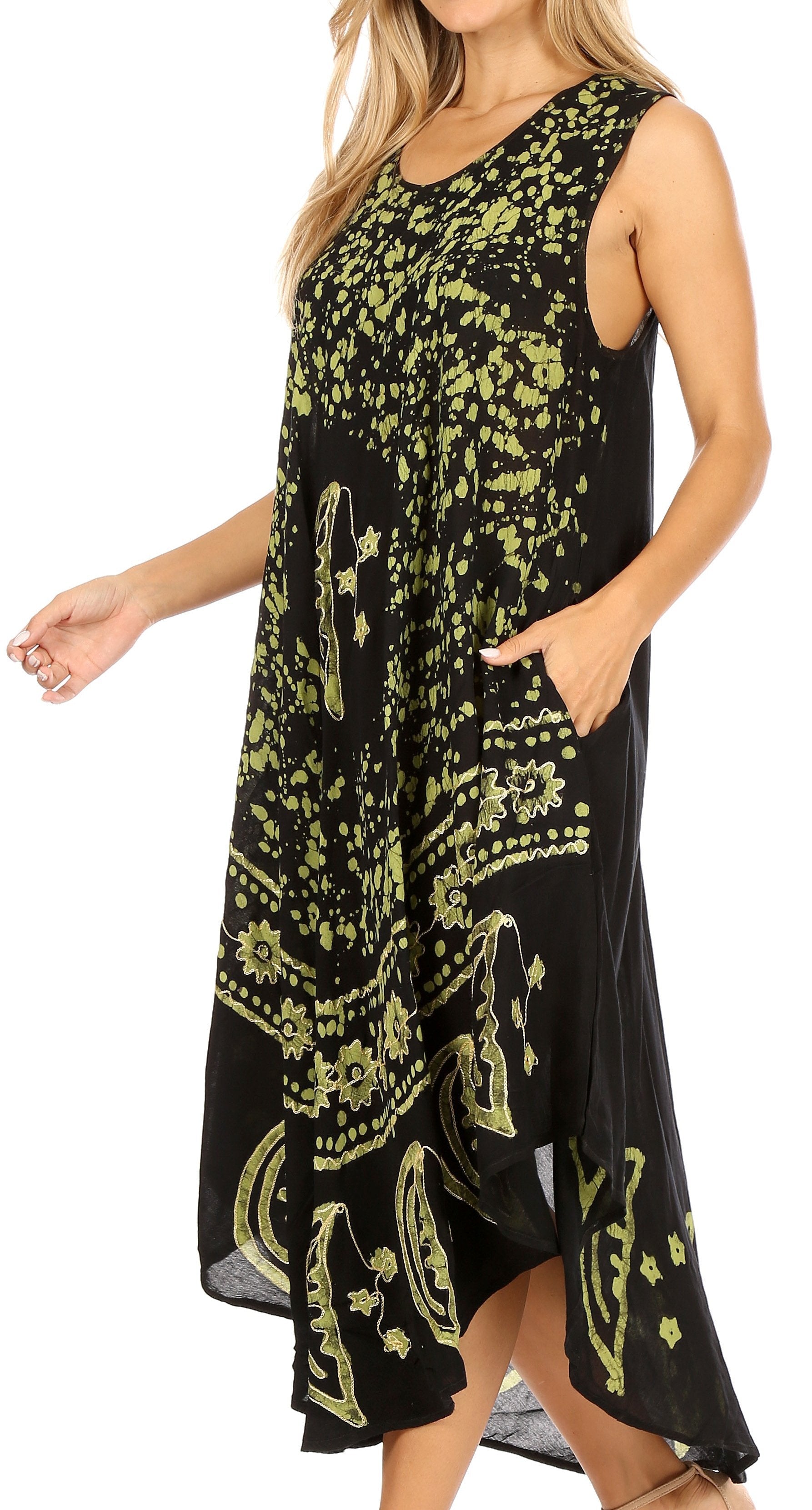 Woman wearing a black dress with yellow floral patterns on a white background