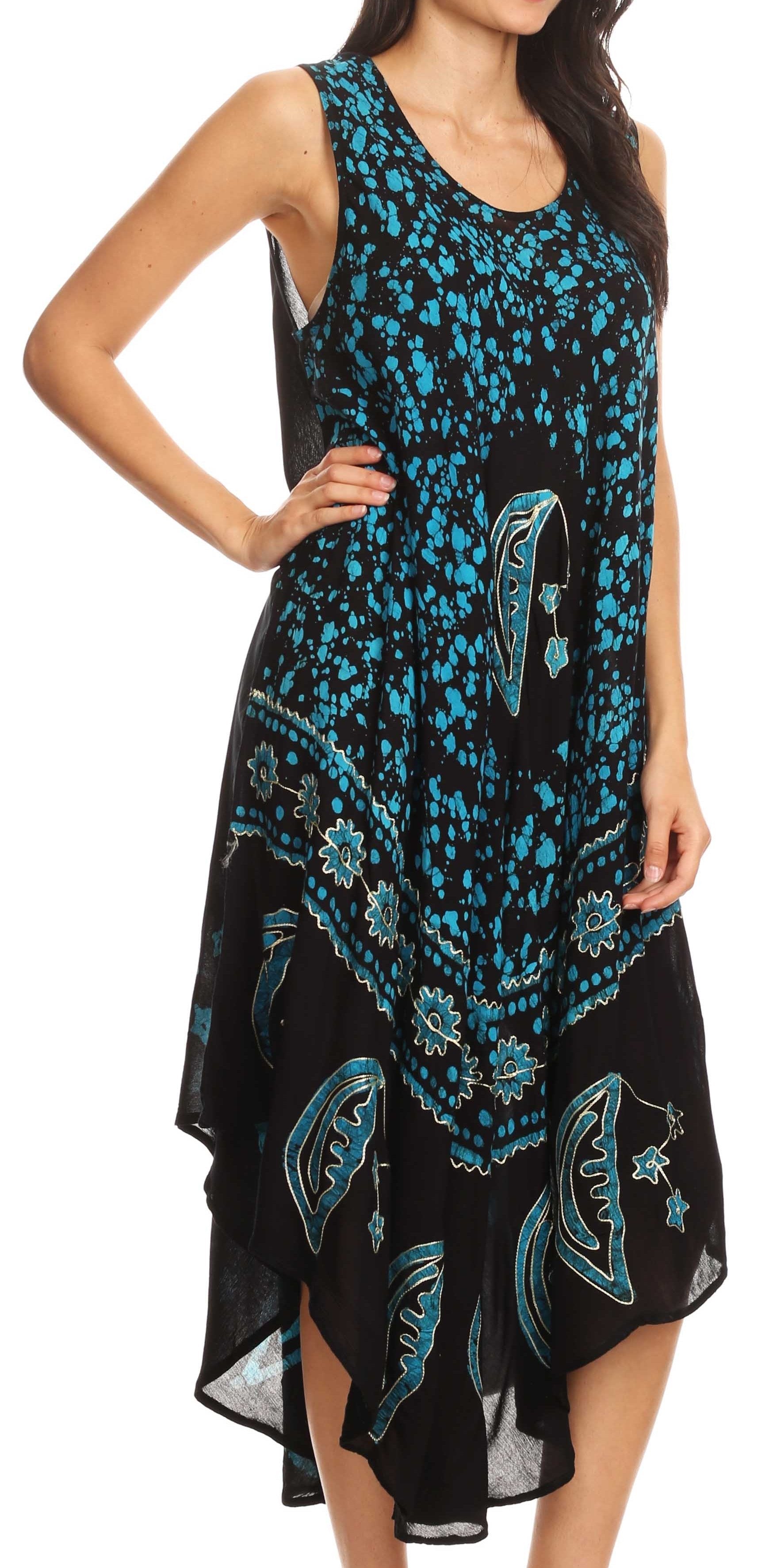 Woman wearing a black sleeveless dress with blue floral patterns on a white background