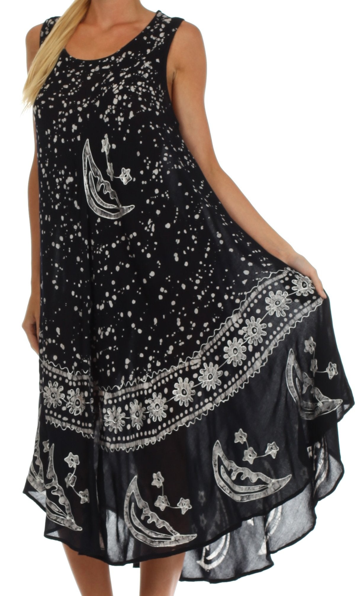 Black dress with white patterns featuring moons and stars on a white background