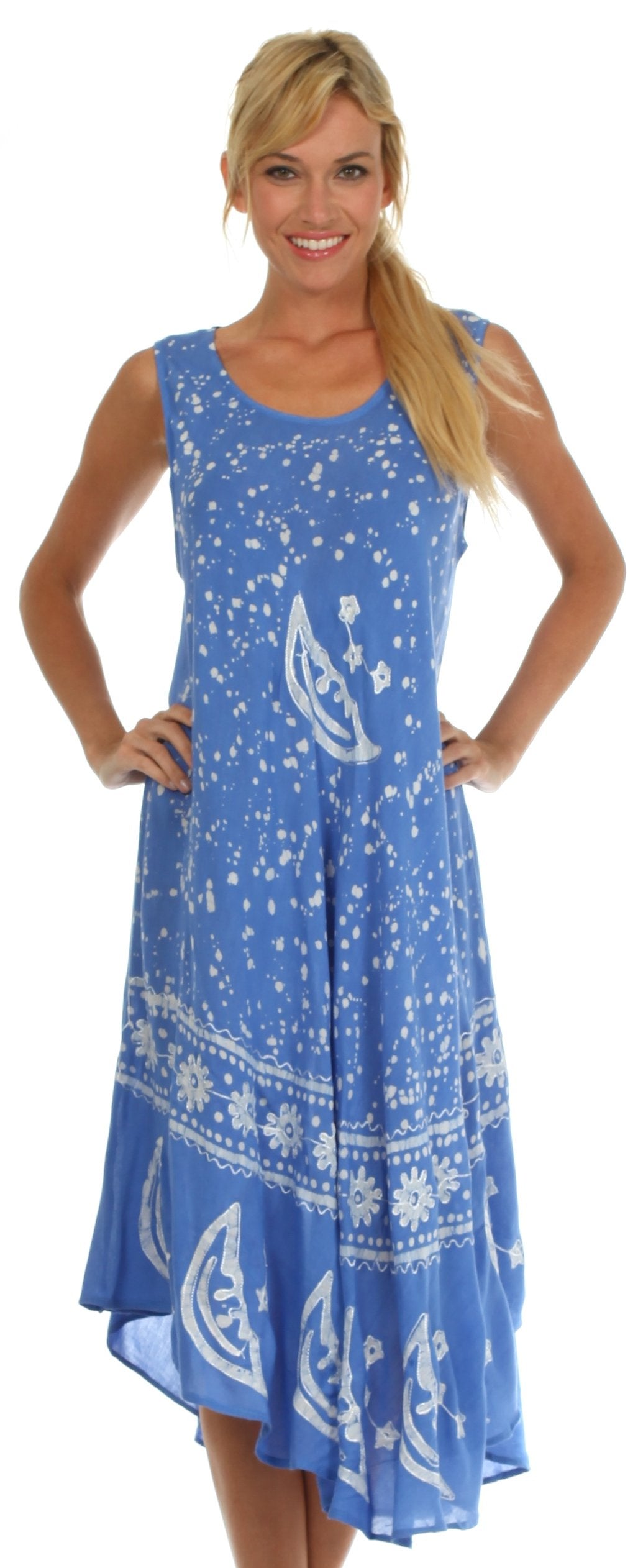 Woman wearing a blue dress with white patterns on a white background