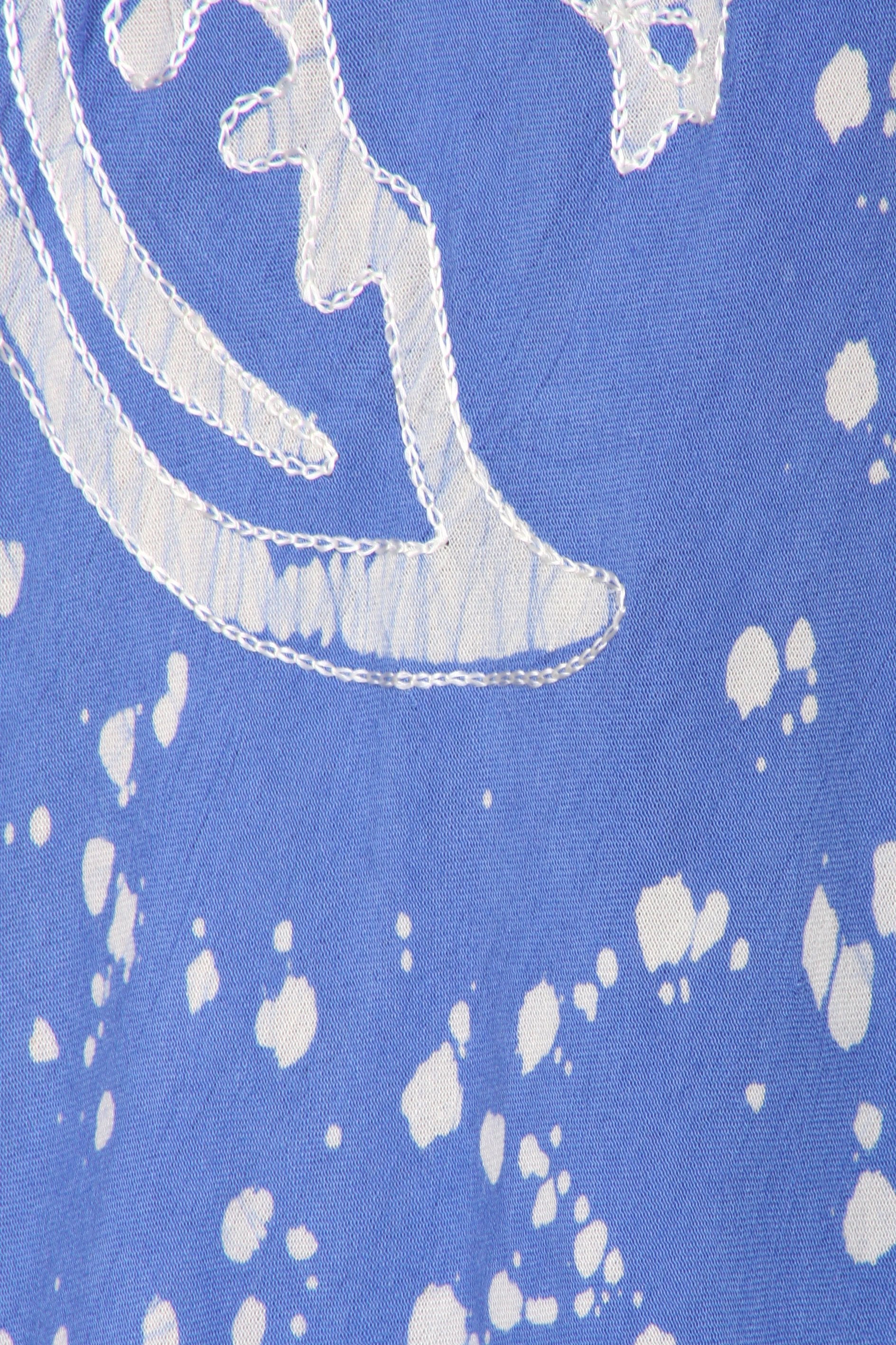 Blue fabric with white abstract patterns