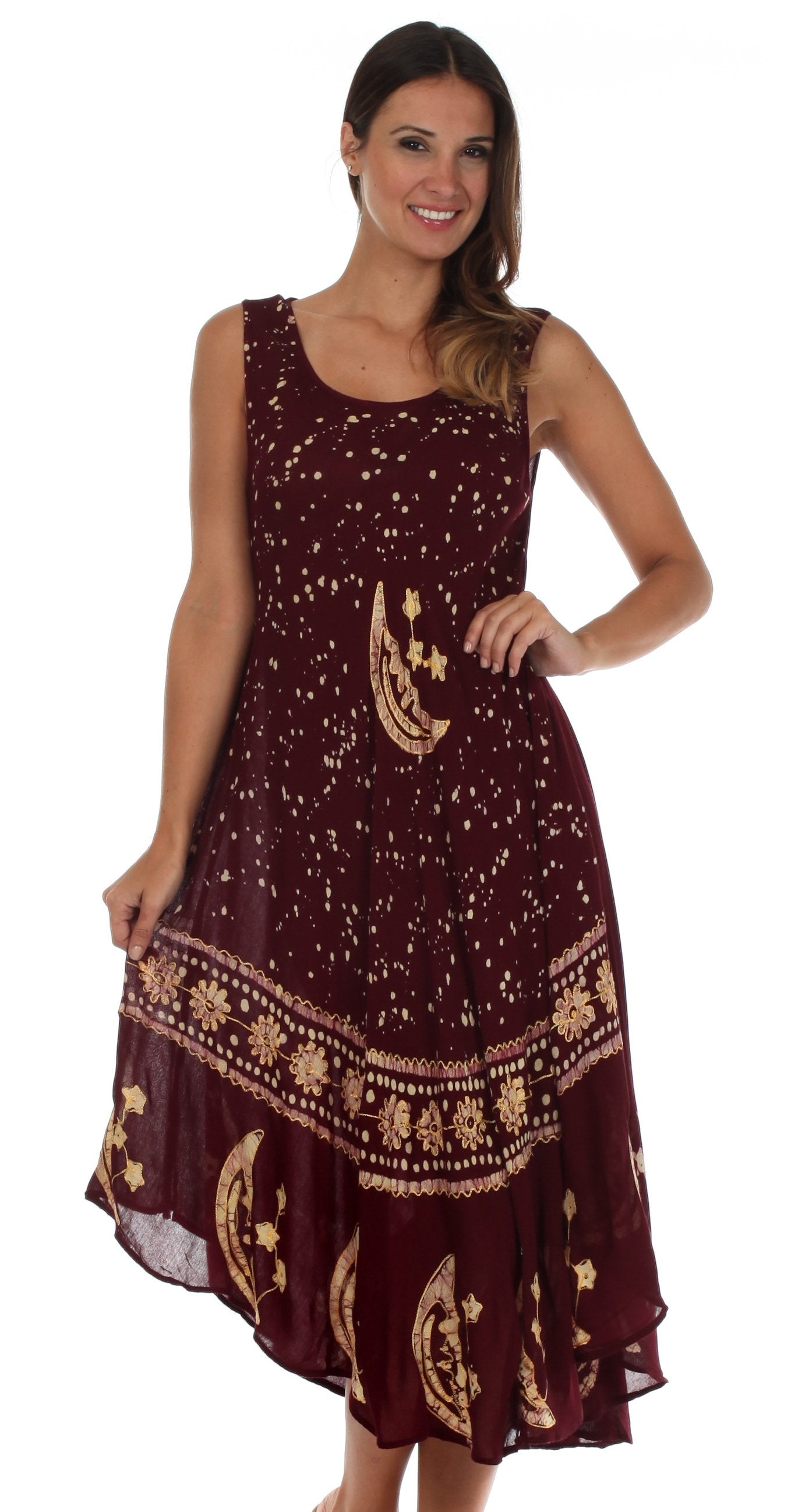 Woman wearing a burgundy dress with gold patterns on a white background