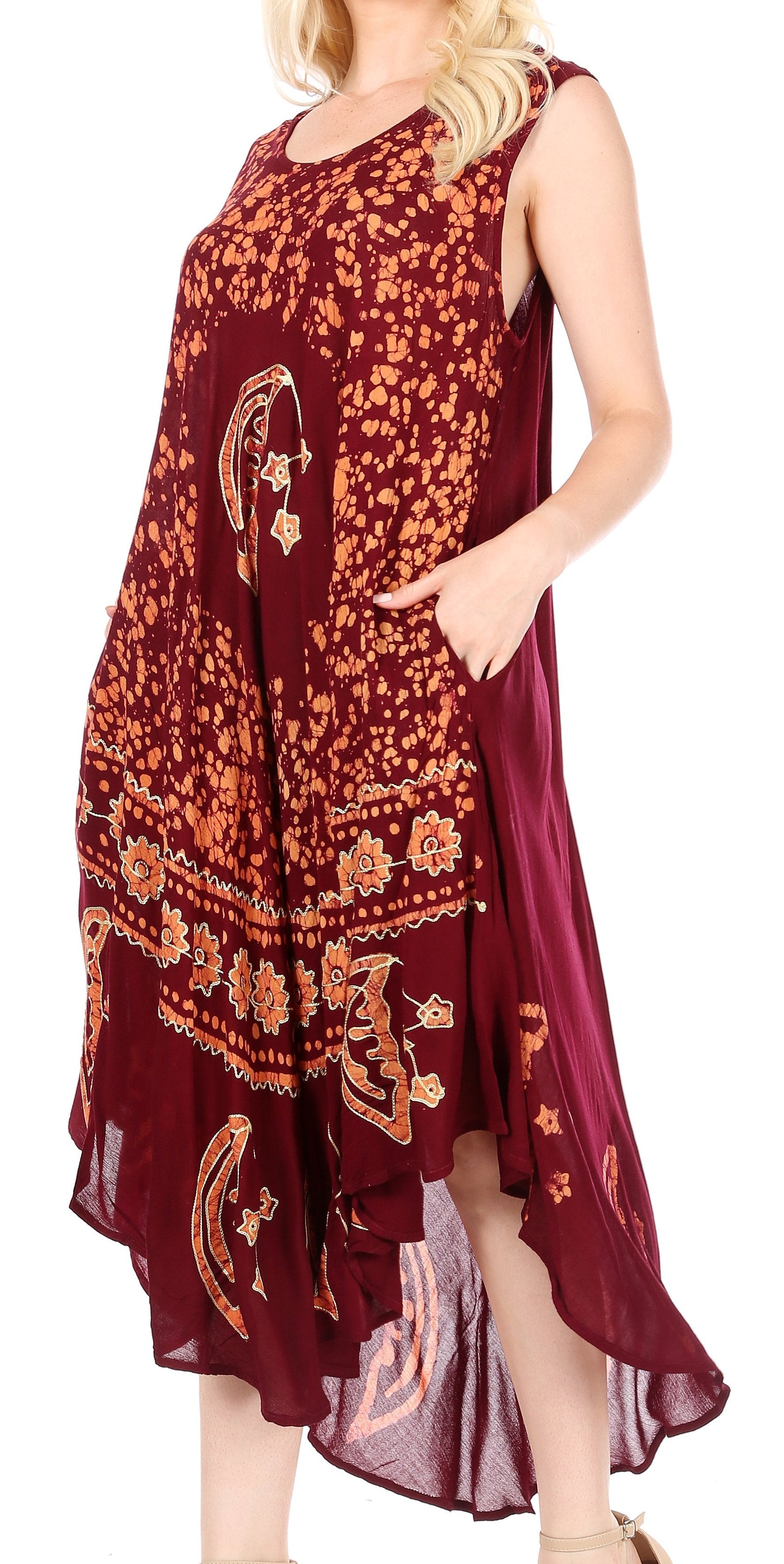 Woman wearing a burgundy dress with floral patterns on a white background