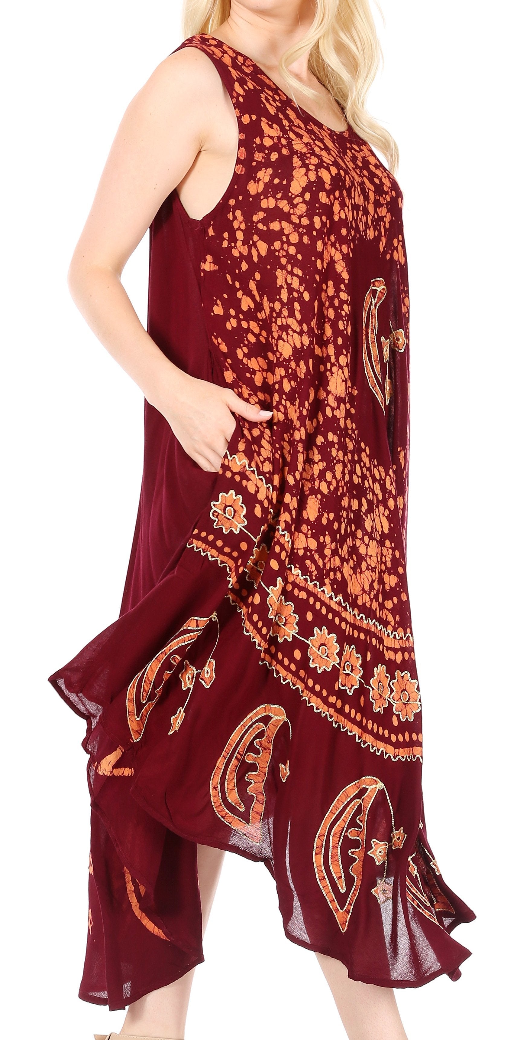 Maroon dress with gold paisley pattern worn by a model on a white background
