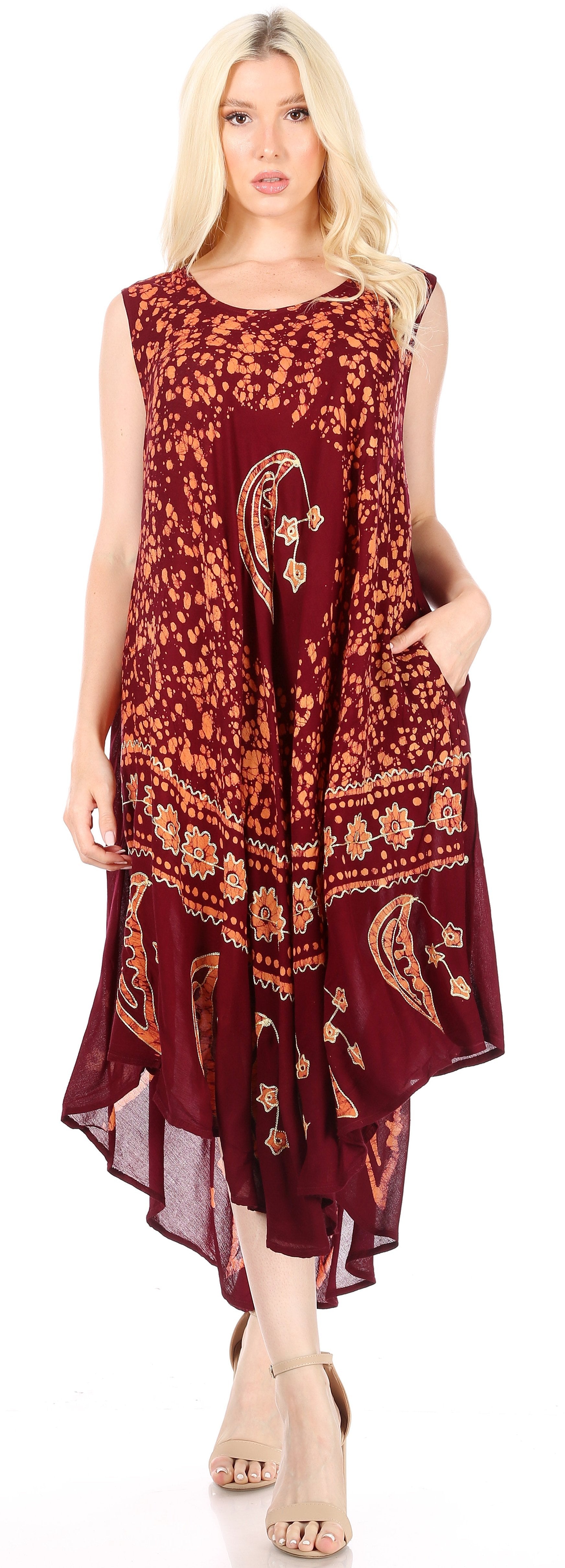 Woman wearing a burgundy patterned dress on a white background