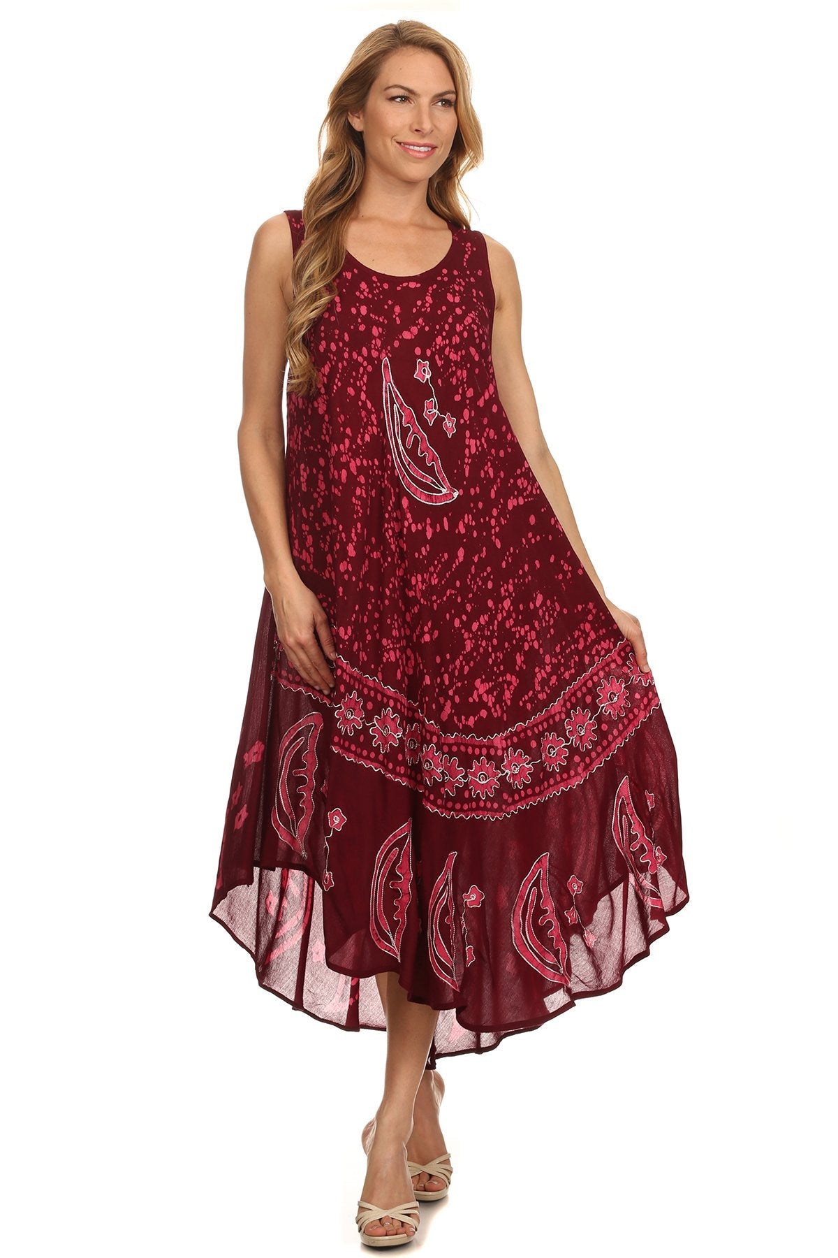 Woman wearing a red patterned dress on a white background