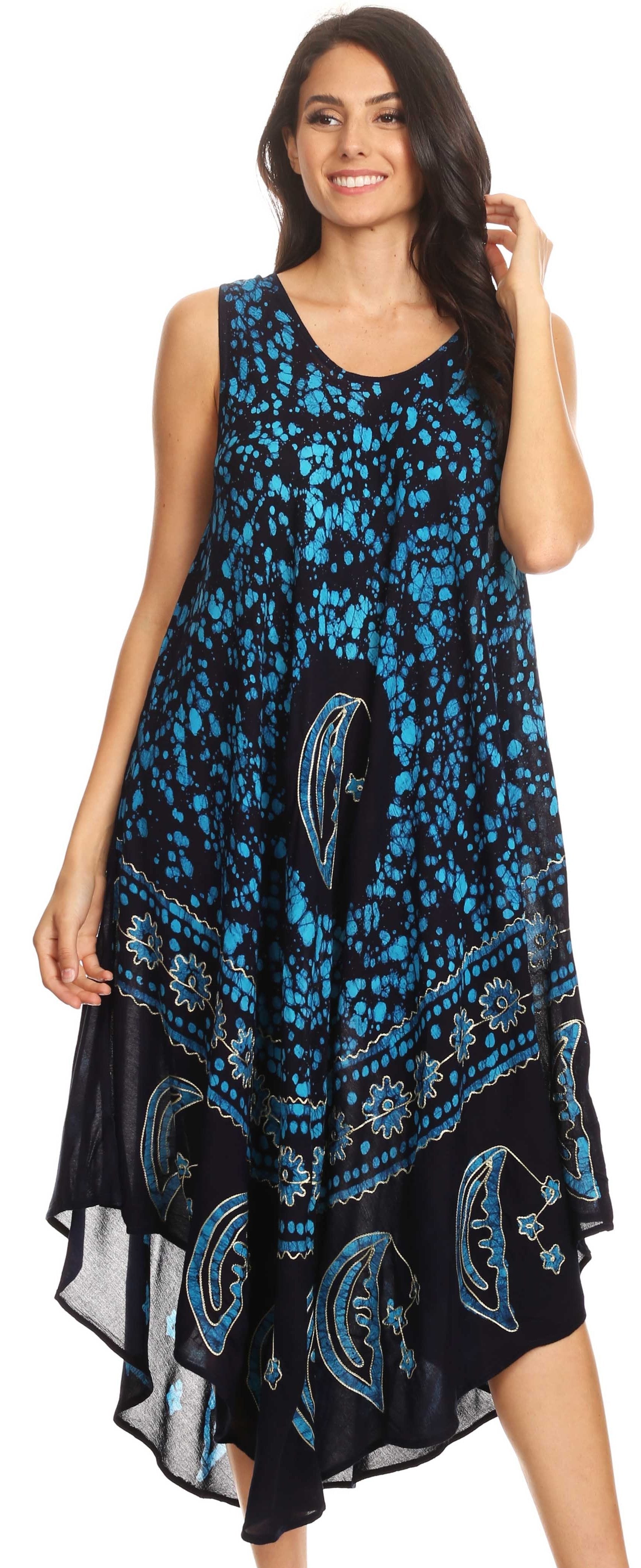 Woman wearing a blue and black patterned dress on a white background