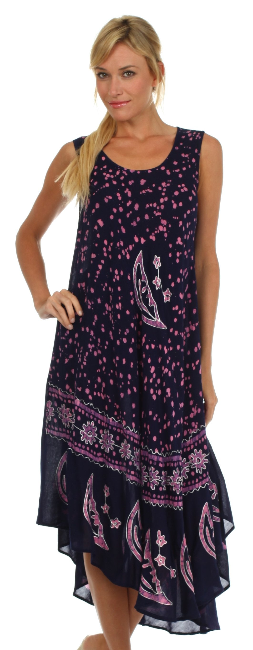 Woman wearing a sleeveless dress with purple and pink patterns on a white background