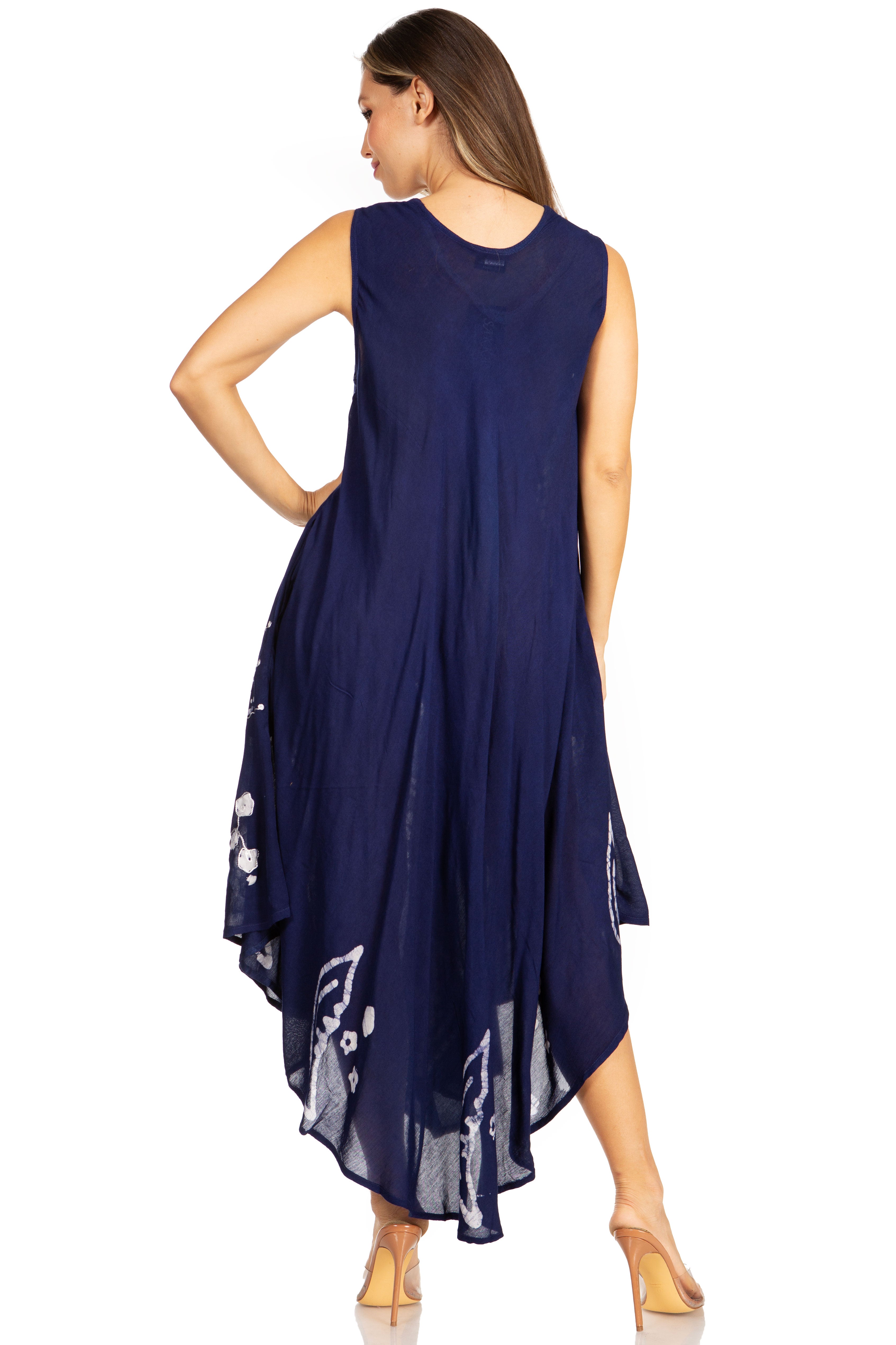 Woman wearing a navy blue dress with floral patterns on a white background