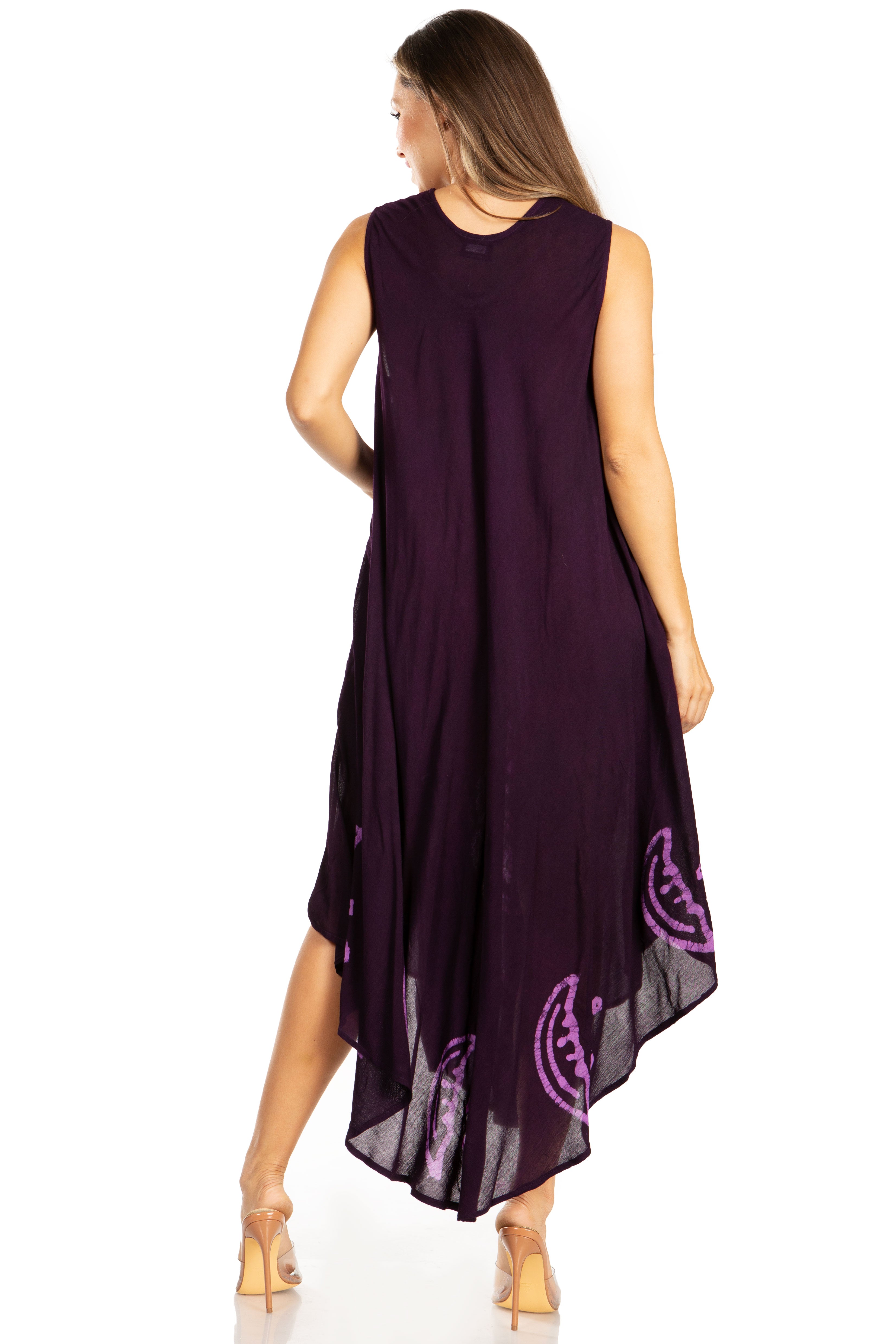 Woman wearing a purple dress with pink patterns on a white background