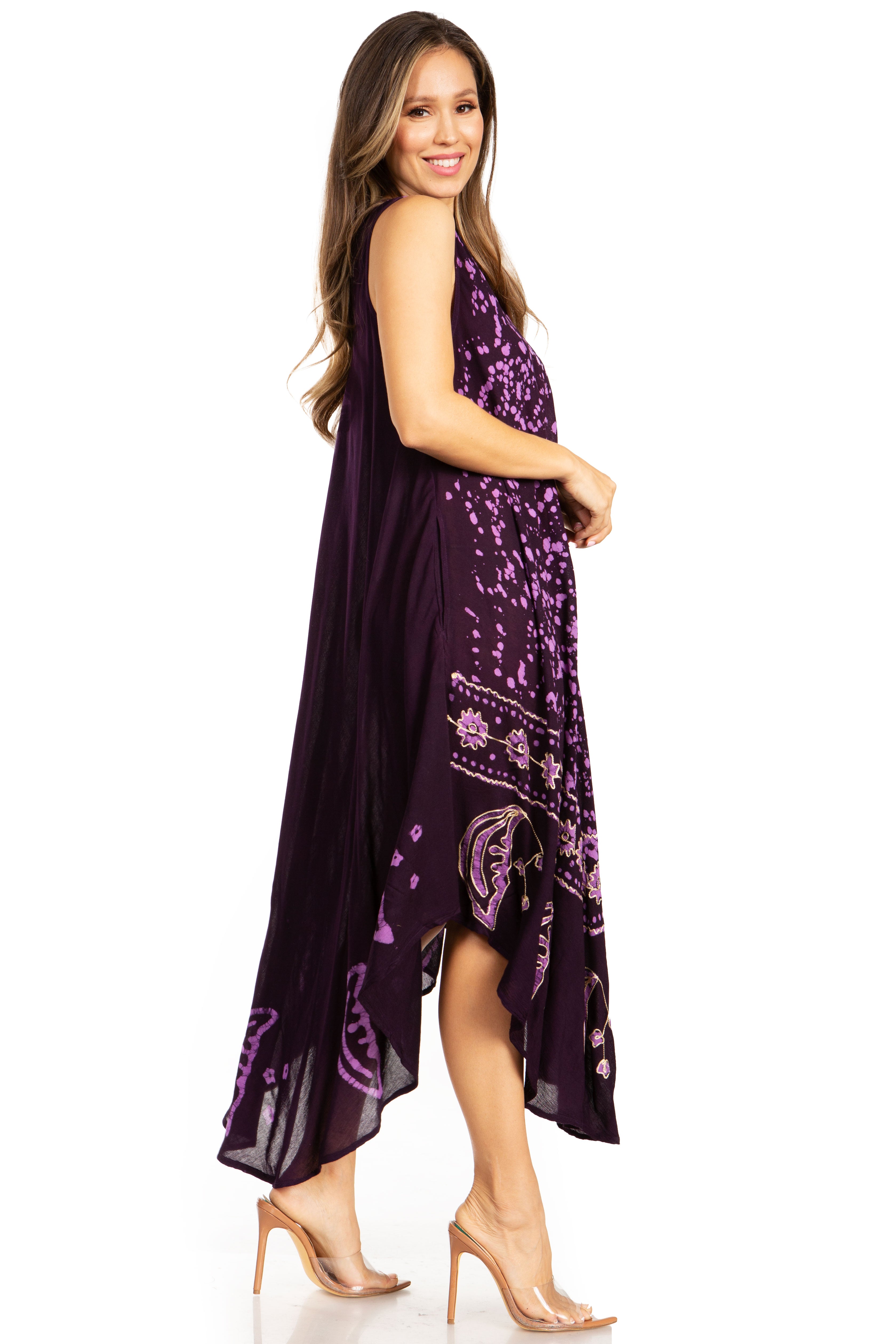 Woman wearing a purple dress with floral patterns on a white background