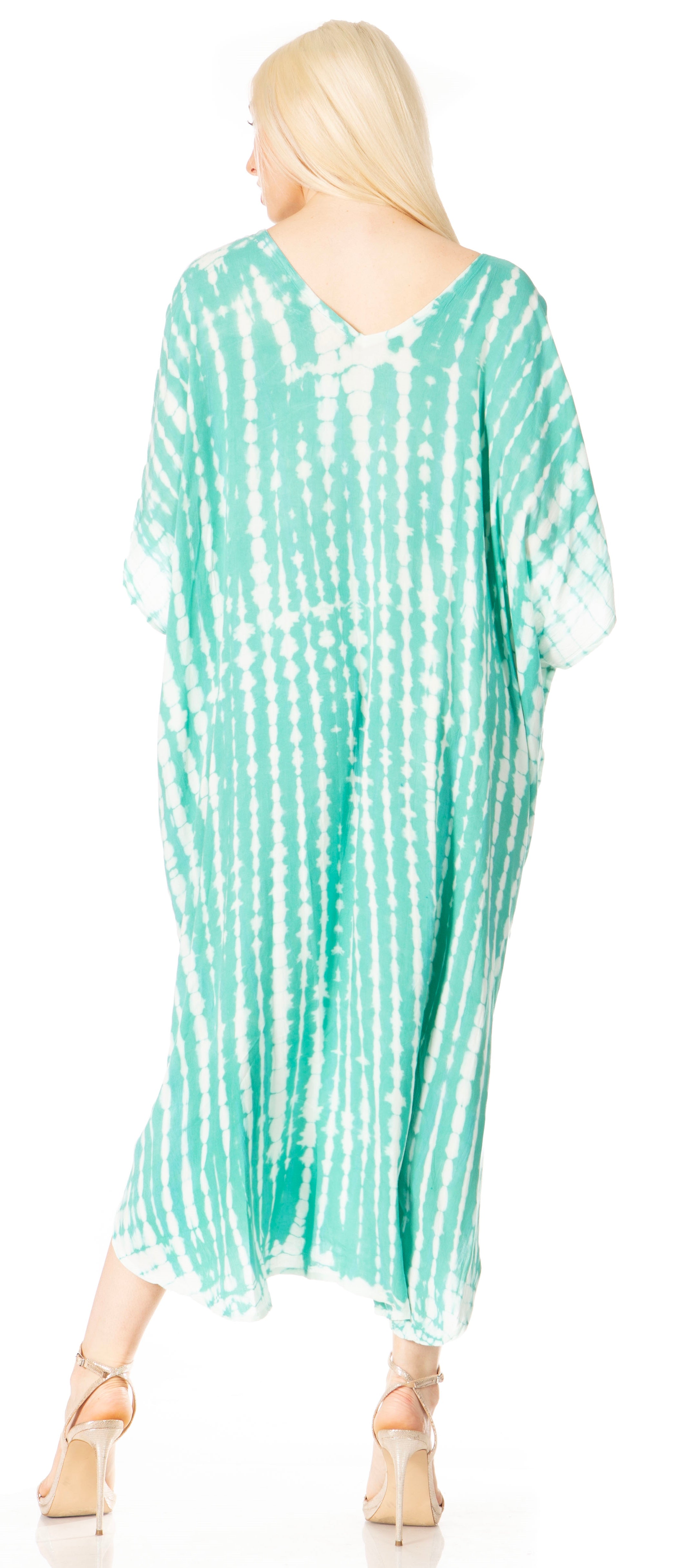 Woman wearing a green and white tie-dye dress on a white background
