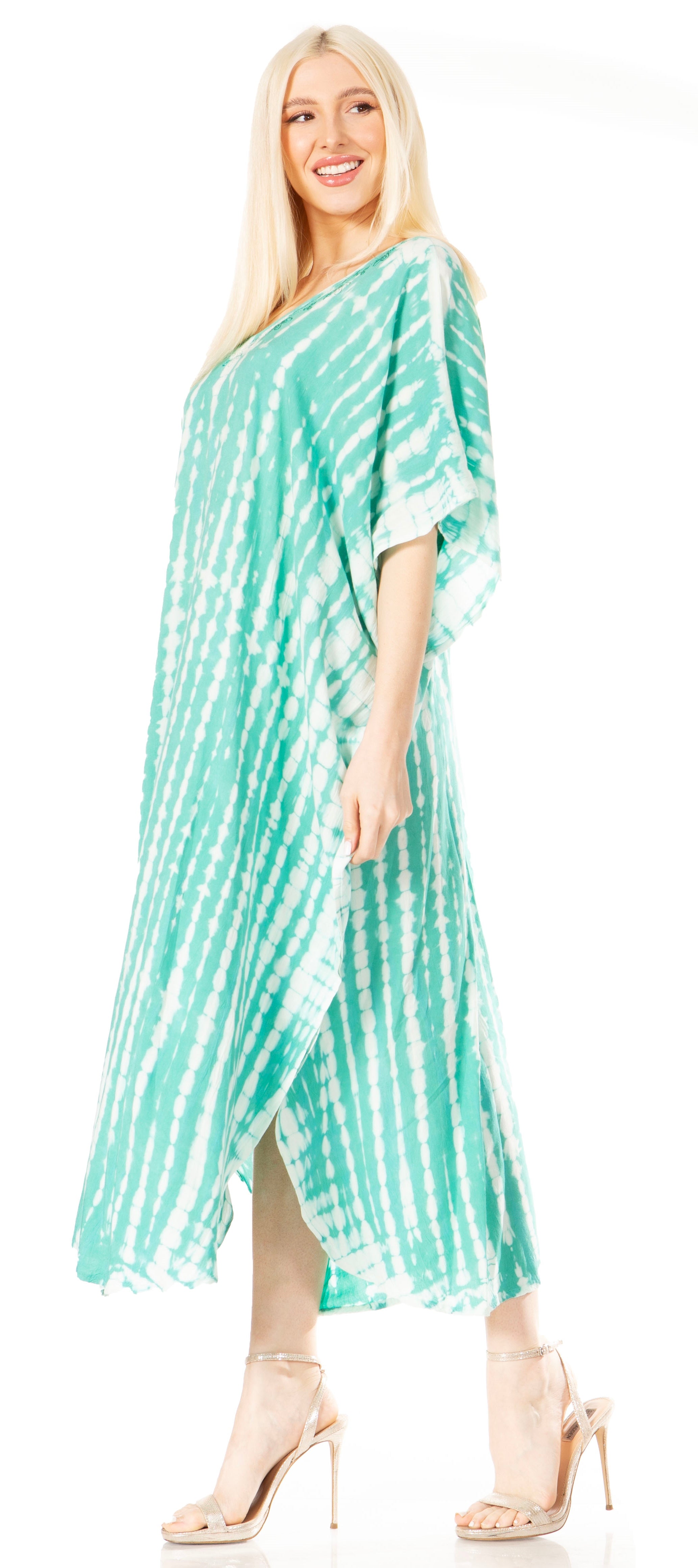 Woman wearing a green tie-dye dress on a white background