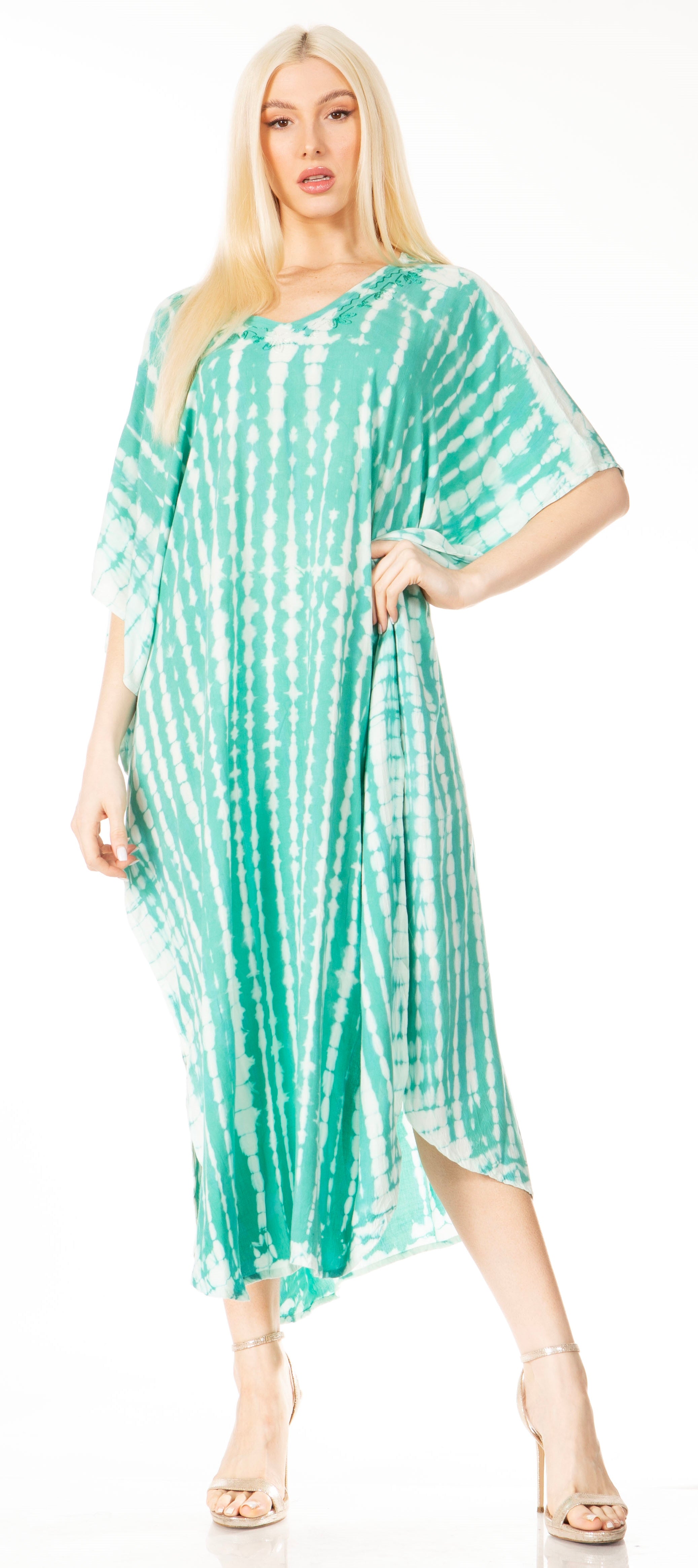 Woman wearing a green tie-dye dress on a white background