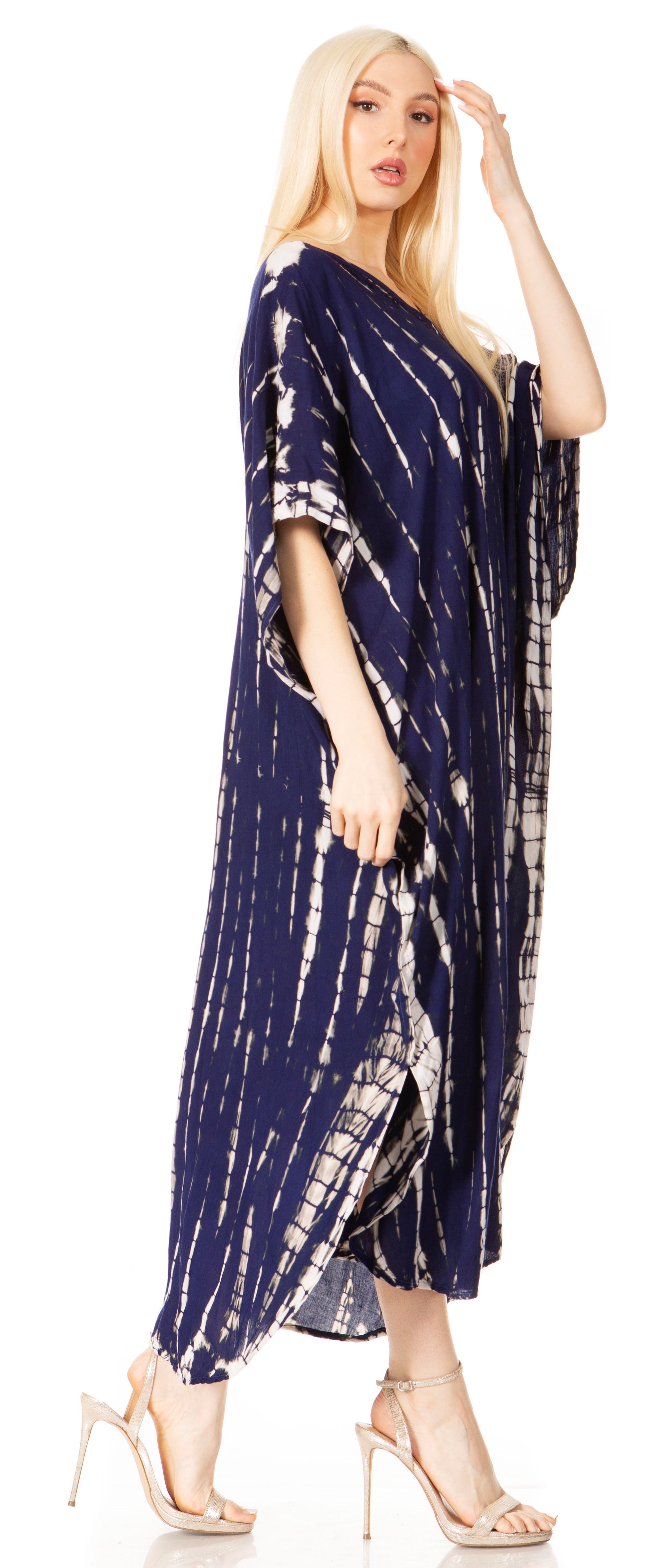 Woman wearing a navy tie-dye dress on a white background