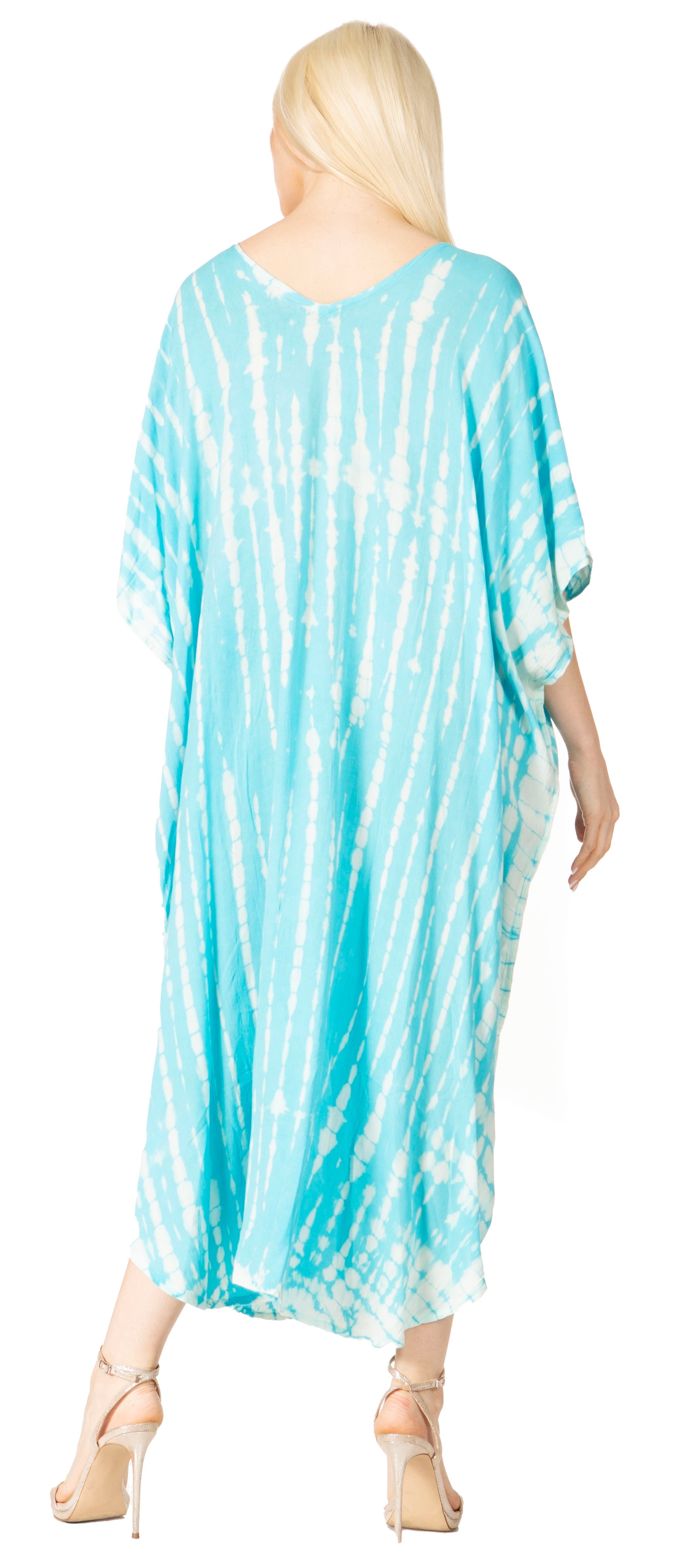Woman wearing a blue tie-dye dress on a white background