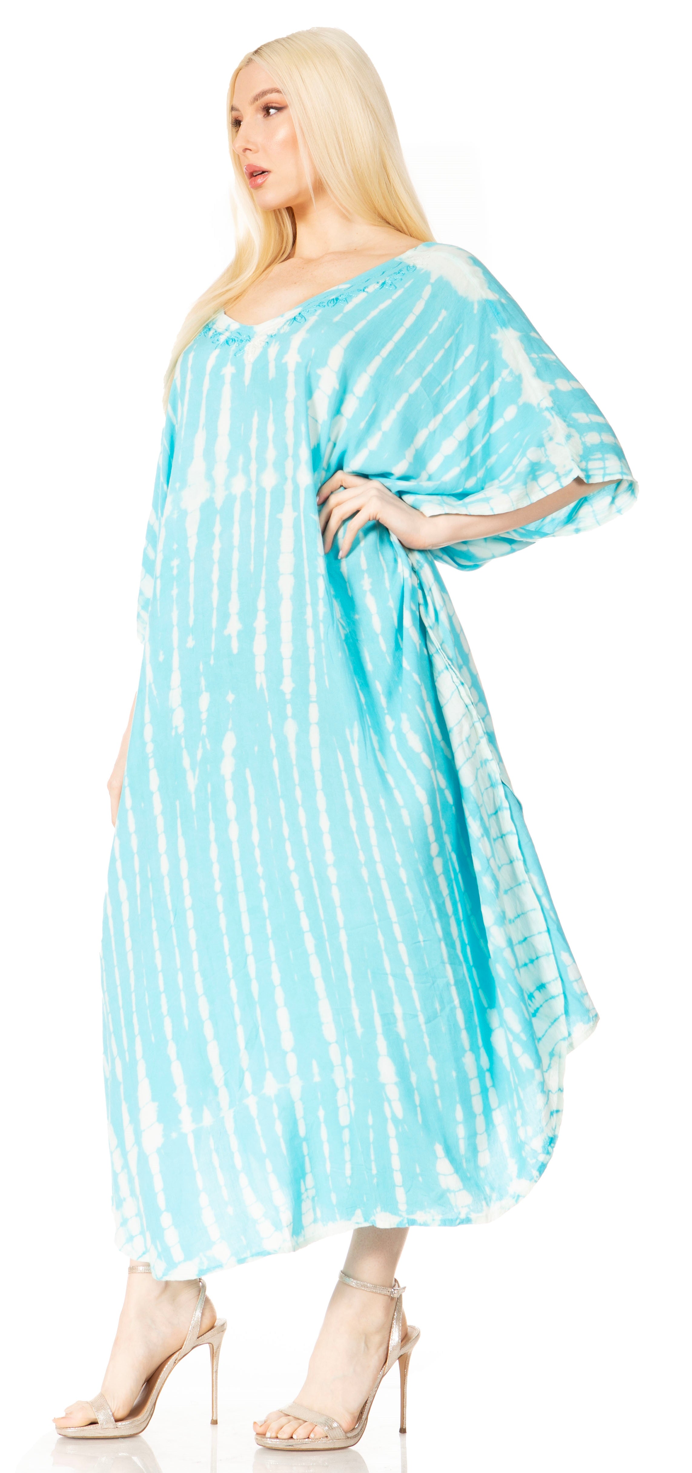 Woman wearing a blue and white tie-dye dress on a white background