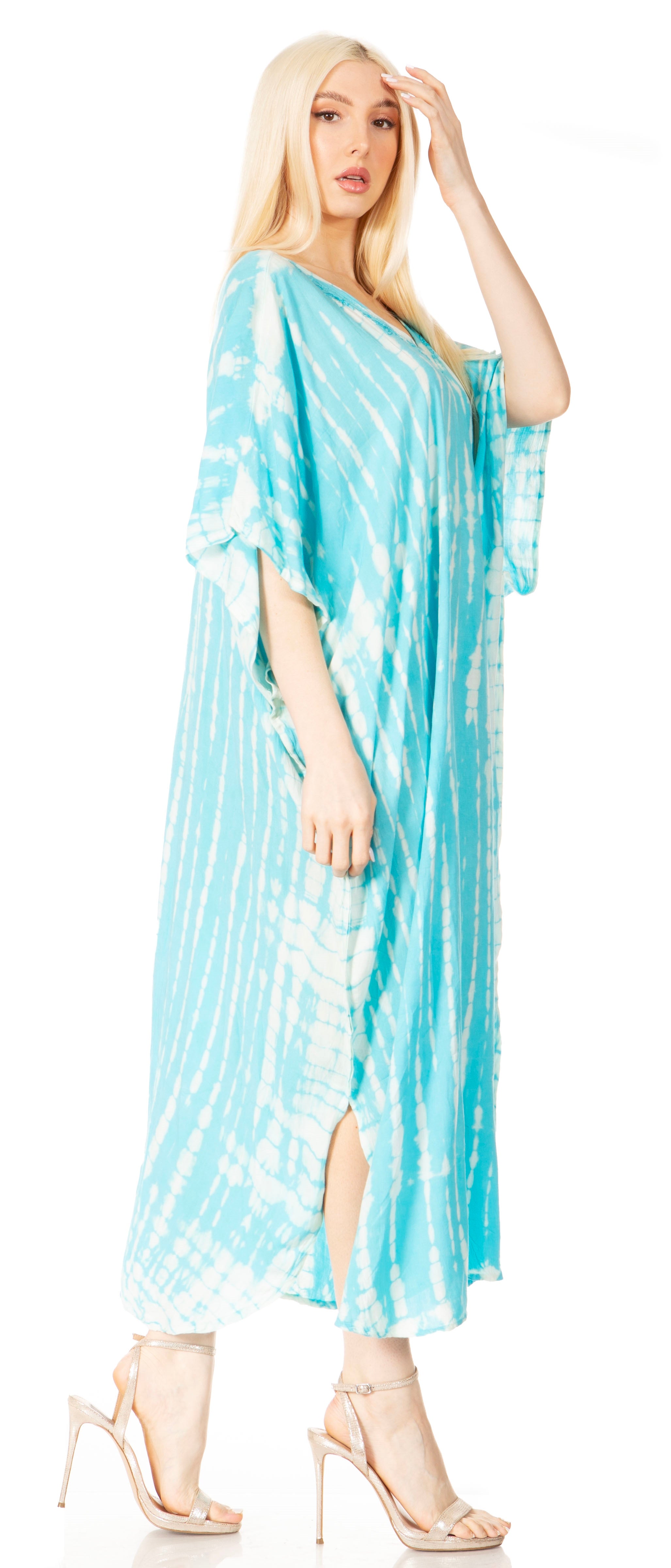 Woman wearing a blue tie-dye dress with a white background