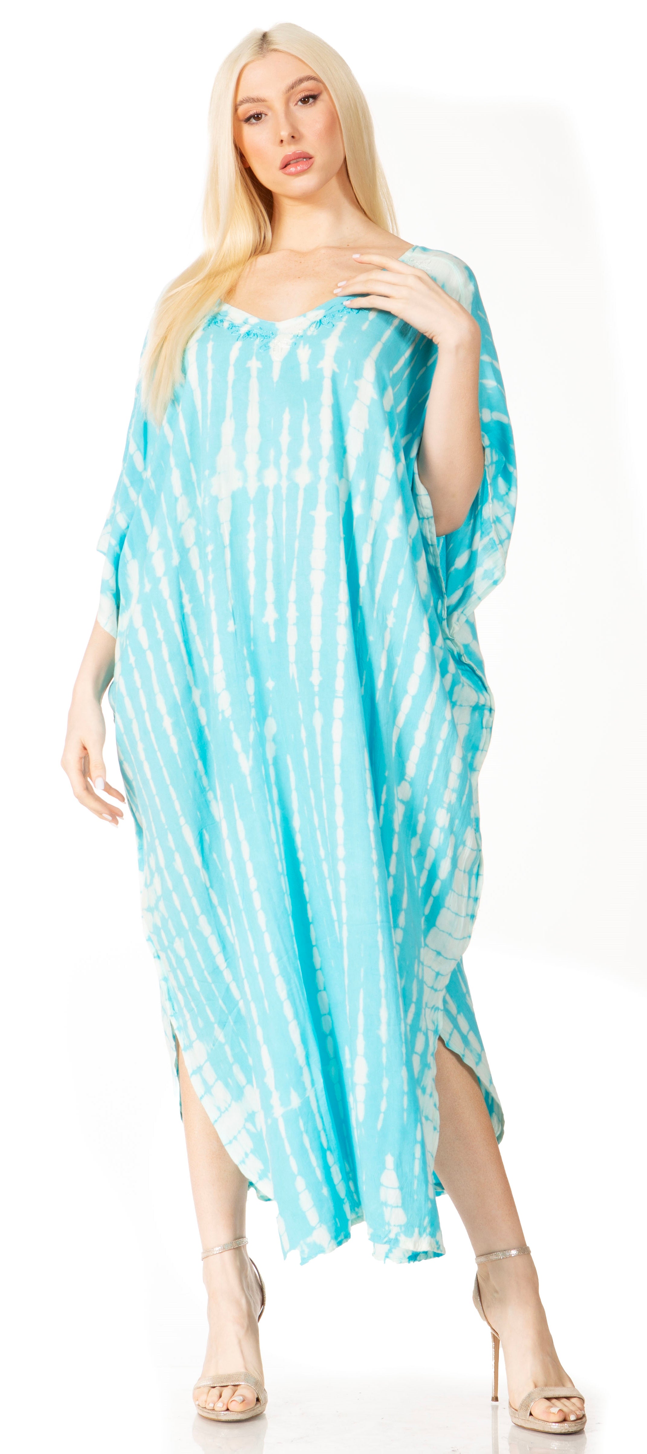 Woman wearing a blue and white tie-dye dress on a white background