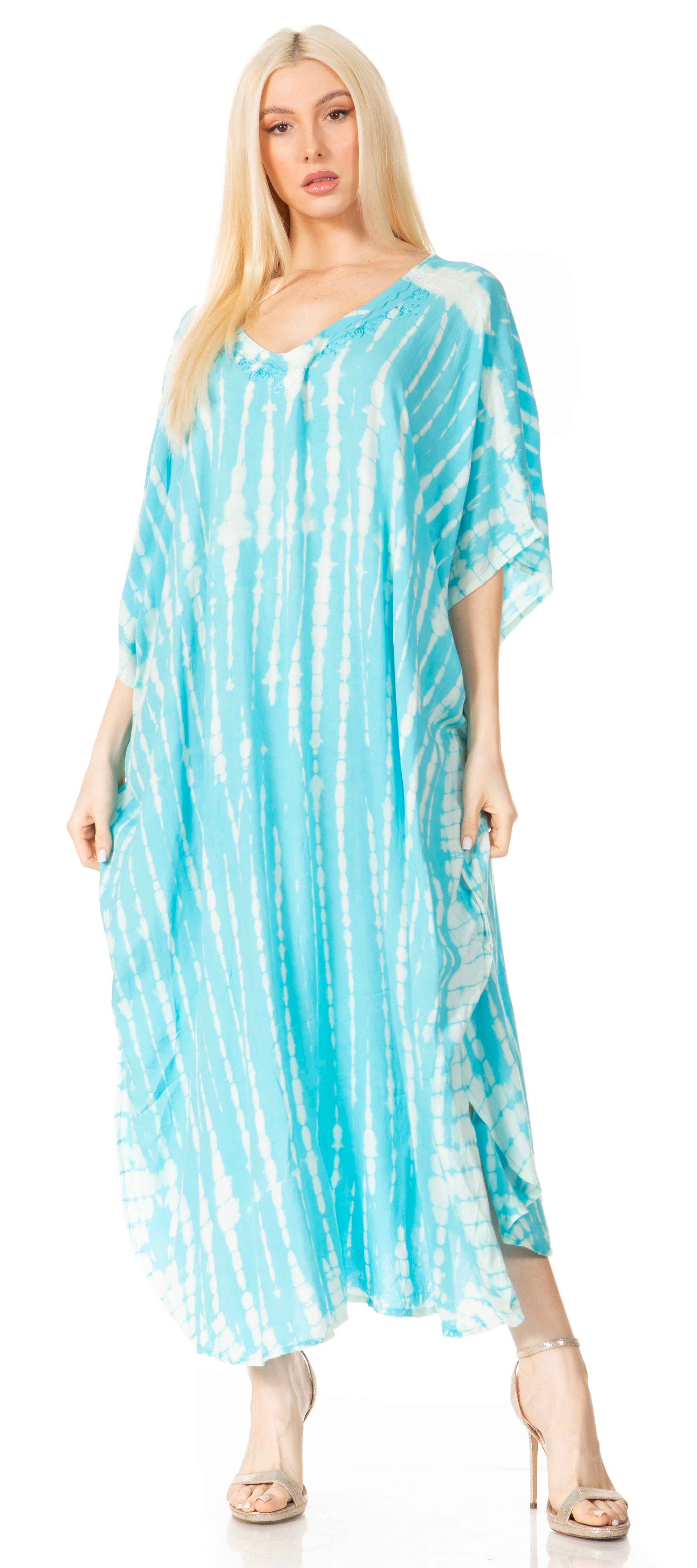 Woman wearing a blue tie-dye dress on a white background