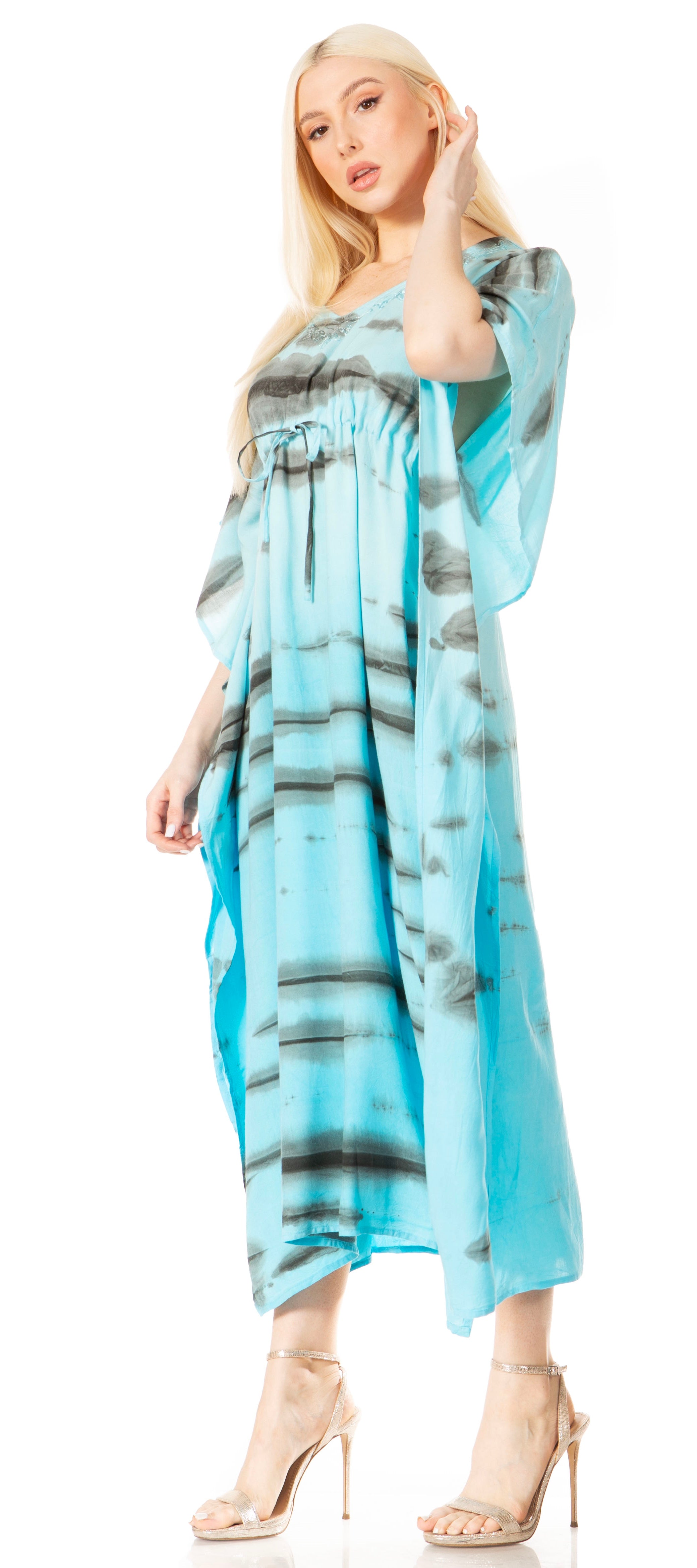 Woman wearing a blue and gray patterned dress on a white background