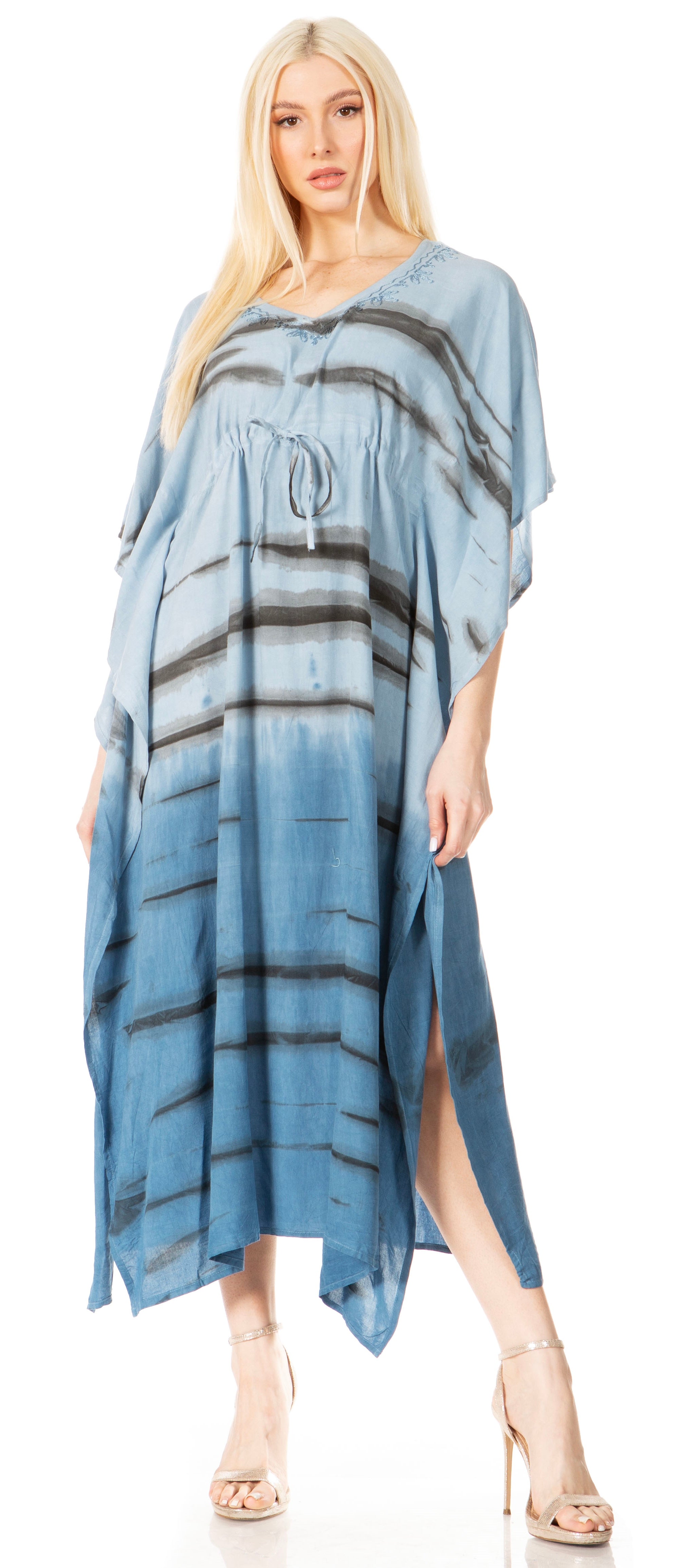 Woman wearing a blue tie-dye dress on a white background