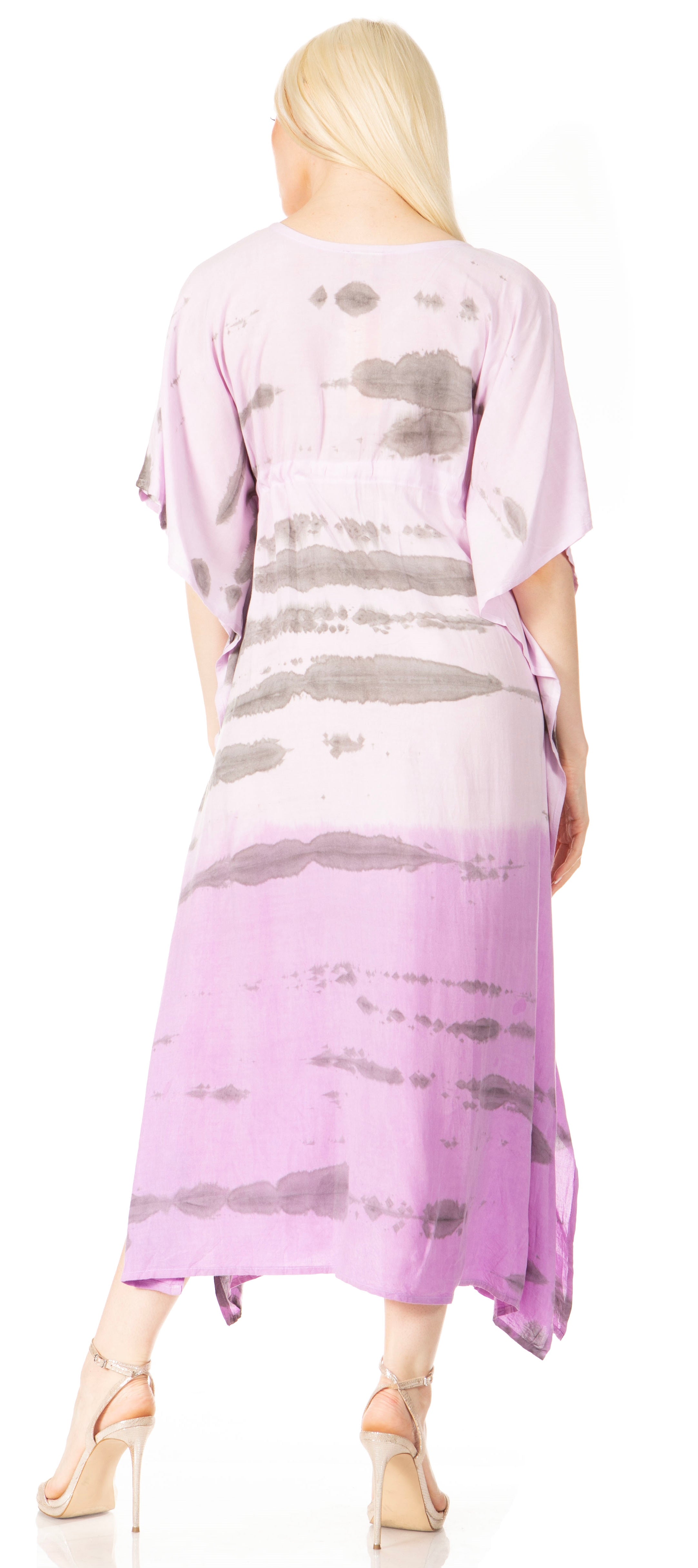 Woman wearing a long, light purple dress with abstract patterns on a white background