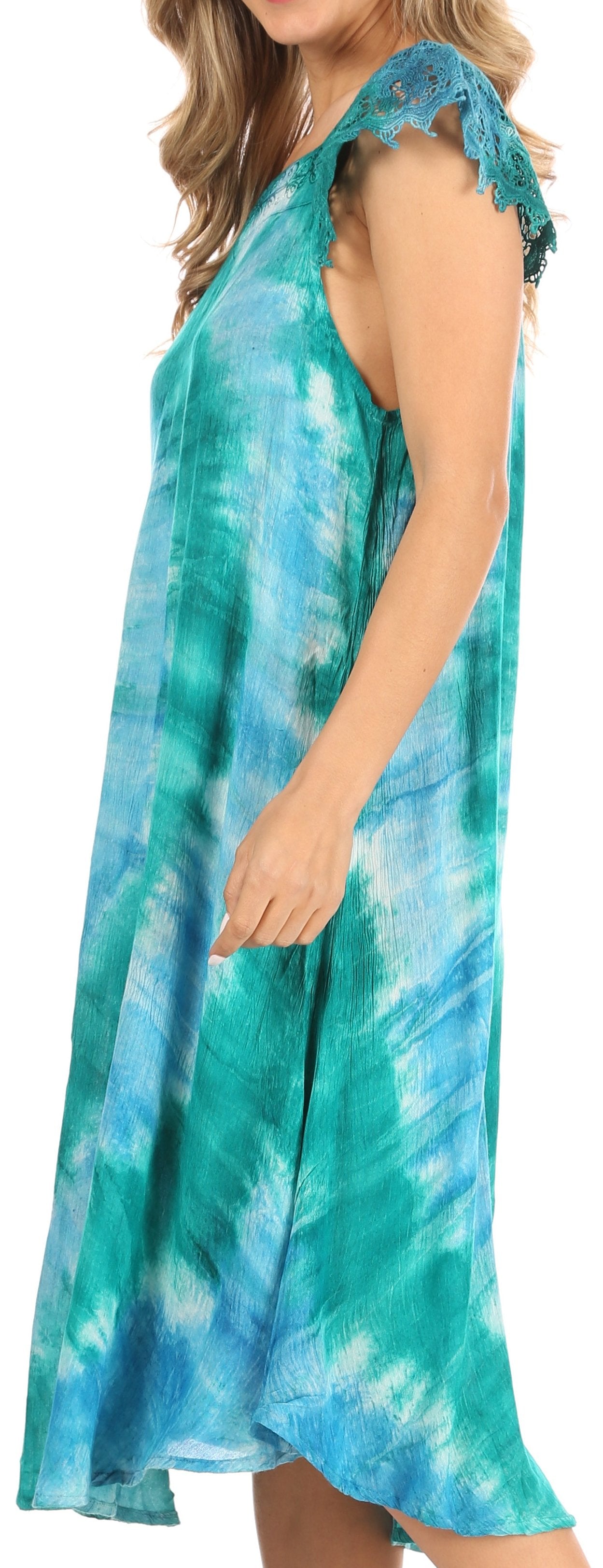 Woman wearing a blue and green tie-dye dress with lace sleeves.