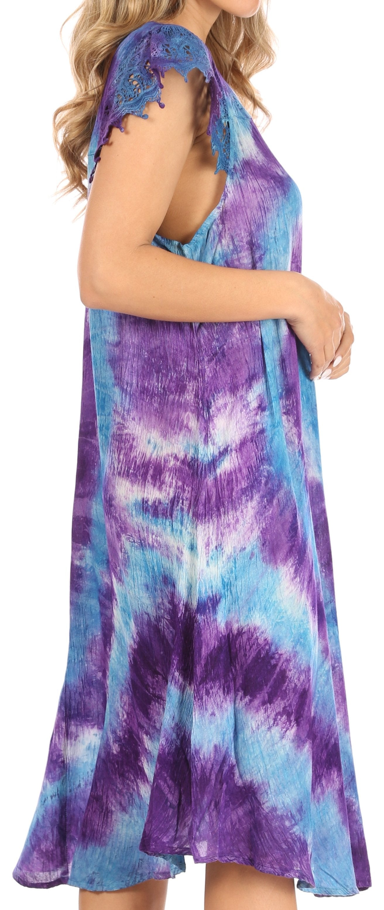 Woman wearing a tie-dye dress with purple and blue patterns.