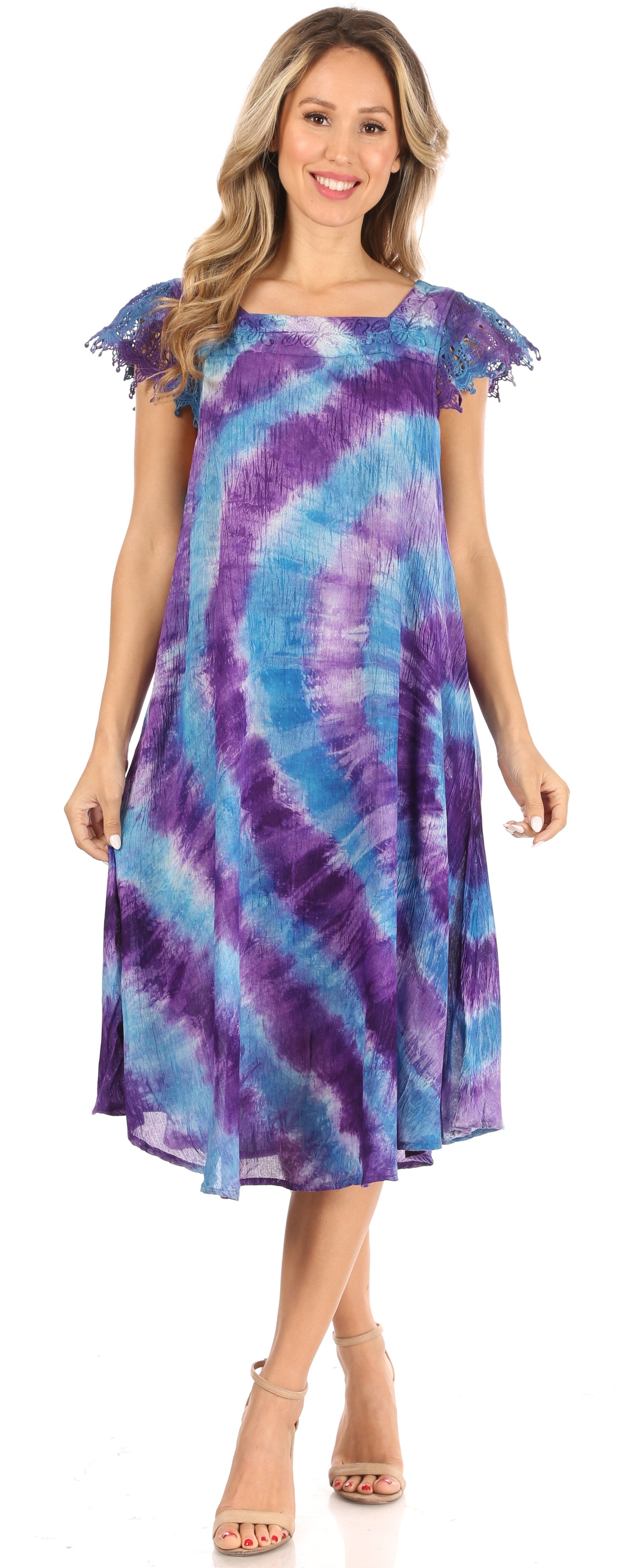 Woman wearing a tie-dye dress on a white background