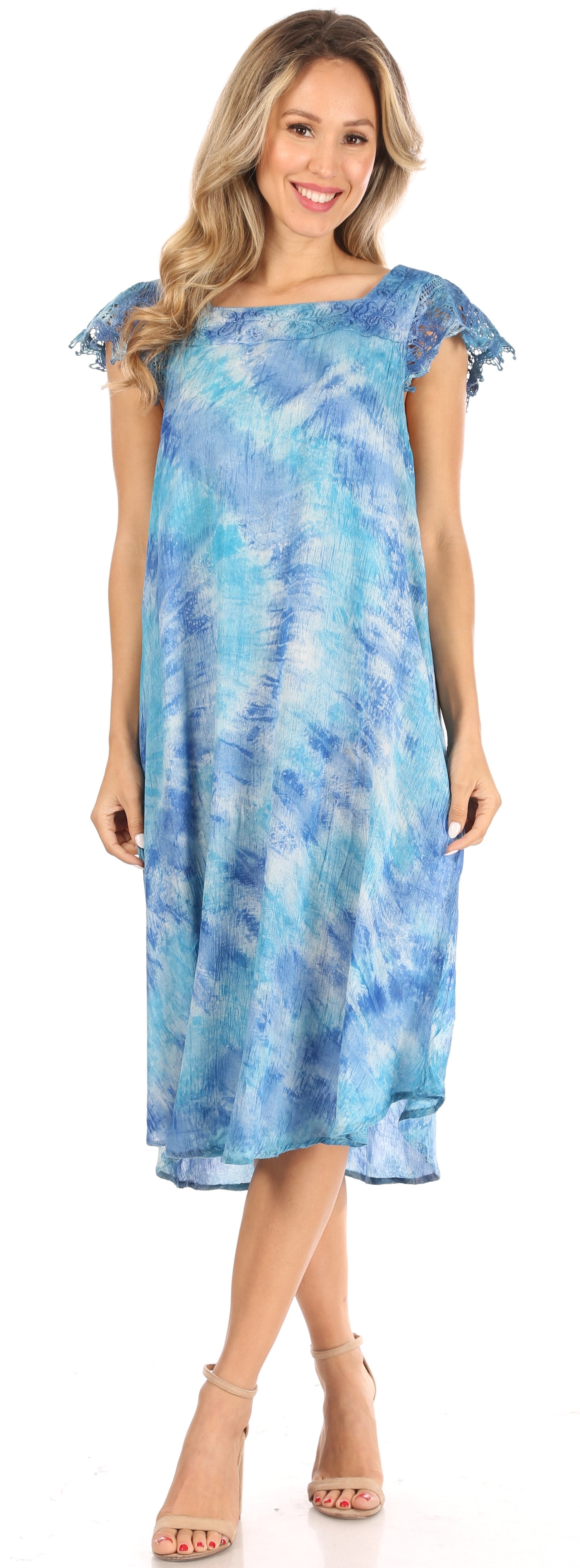 Woman wearing a blue tie-dye dress on a white background